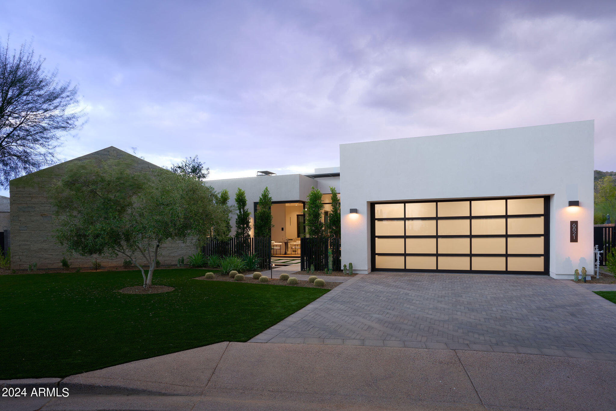 Welcome to AZURE! Never lived in, NEW CONSTRUCTION, Residence 4 with a DETACHED CASITA & an OVERSIZED, 26' wide WALK-OUT LOWER LEVEL, the largest in the community, putting an exclamation point on the MULTIPLE OUTDOOR ENTERTAINMENT spaces. This PREMIUM LOT LOCATION is one of the largest in Azure giving you phenomenal UNOBSTRUCTED VIEWS of MUMMY AND CAMELBACK MOUNTAINS! Interiors have been EXPERTLY CURATED by Ownby Design as well as some UNIQUE DESIGN ELEMENTS by the seller not present in other Res 4's. From the MASSIVE GLASS WALL SLIDERS, GAGGENAU appliances & PROVENZA wood floors, to the HEATED pool & spa, BOCCE BALL court and CUSTOM LIGHT FIXTURES by Lightform, this home will not disappoint. And to top it all off, All builder WARRANTIES TRANSFER!