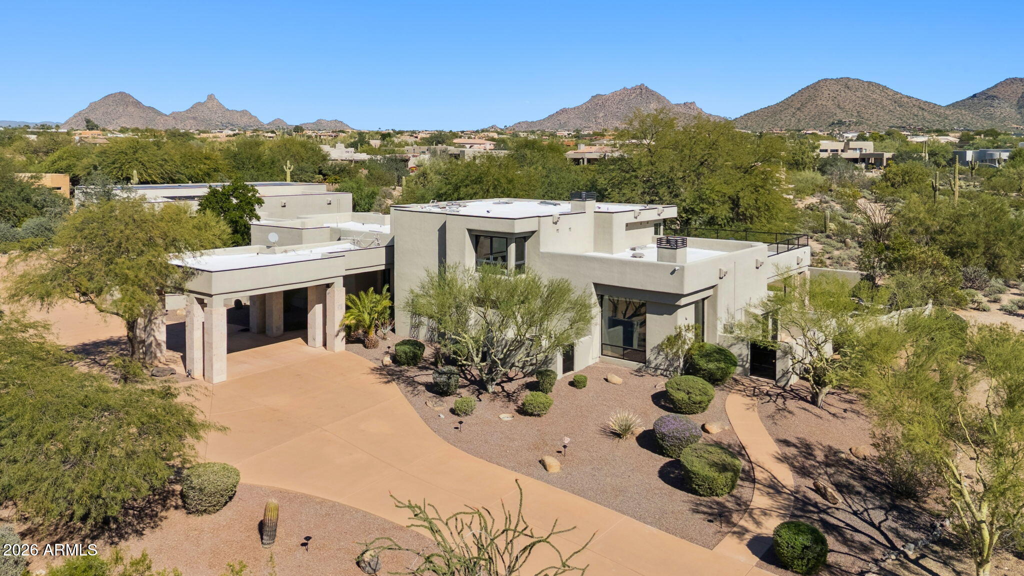 Welcome to 9350 E. Via Del Sol Drive, a rare custom estate offering timeless architecture, exceptional privacy, and sweeping mountainand city-light views from nearly every room. Set on 1.5 acres at the end of a quiet cul-de-sac in coveted 85255, this 7,800-square-foot residence blends serene seclusion with effortless access to North Scottsdale's finest dining, shopping, and entertainment. Thoughtfully updated and impeccably designed, the home features a luxurious primary suite with private balcony, multiple ensuite guest bedrooms, refined entertaining spaces, a wine room, and expansive indoor-outdoor living ideal for both grand gatherings and quiet retreat. An oversized garage anchors the estate. Complimented by an expansive, indoor multi-purpose entertaining space -easily convertible in one of a kind automotive showcase or private gallery. Together these spaces create an unparalleled opportunity for the conventional owner, extended family, mother -in- law arrangement, teenager suite, or the discerning car collector seeking both refined living and exhibition -quality presentation.