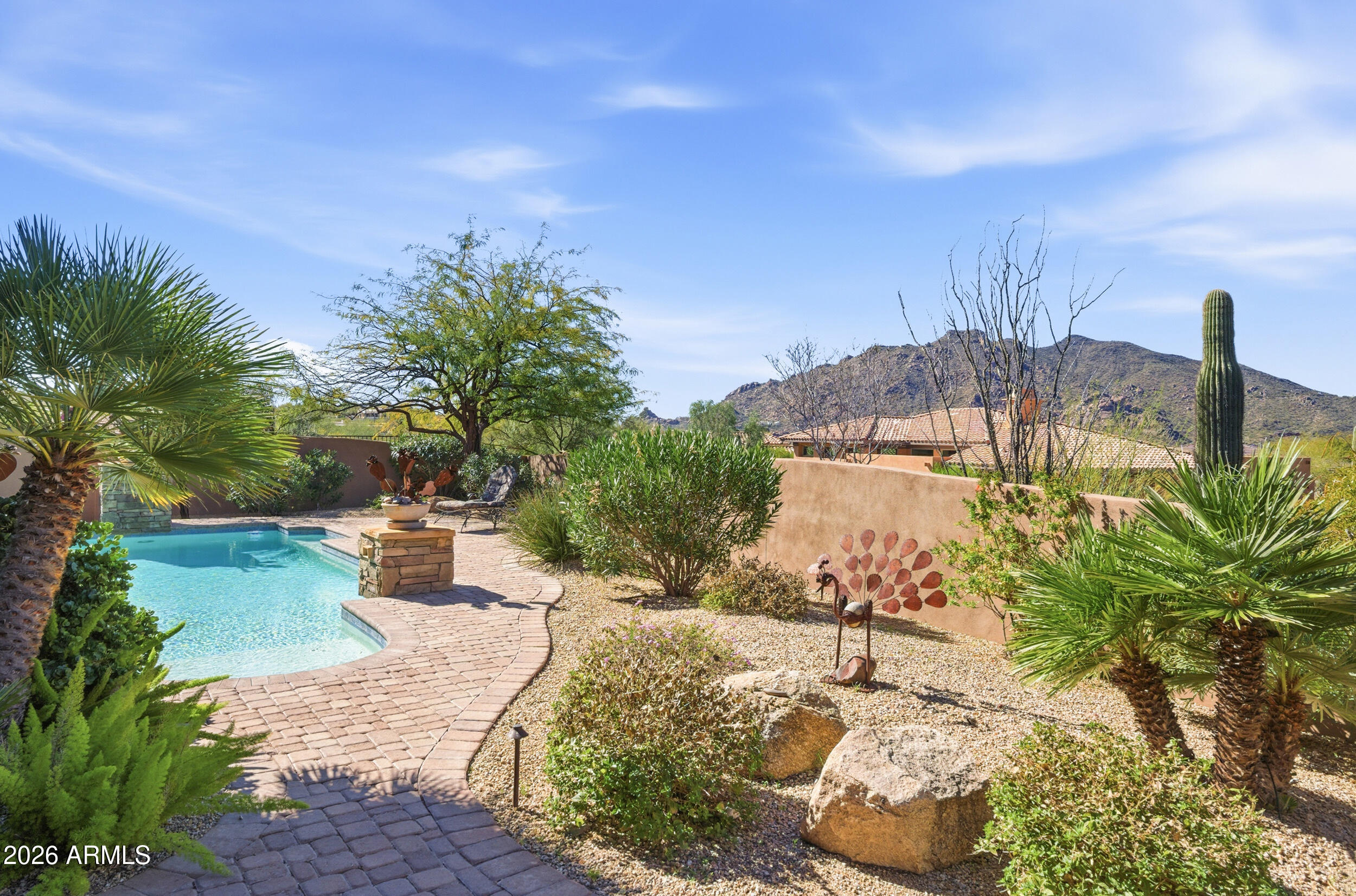 Experience the pinnacle of high-performance luxury in this custom Classic Stellar masterpiece, situated on a quiet & desirable cul-de-sac in the gated Reserve at Tranquil Trail. Unlike mass-produced builds, this home features a signature airtight thermal envelope designed for maximum energy efficiency and climate control. The interior impresses with 12'+ ceilings, travertine flooring, and solid core Alder doors. A chef's kitchen complete with thick granite, custom cabinetry, and a social island flows into a sun-drenched family room. Retreat to the primary suite for spa-like indulgence with a multi-head walk-in shower and private patio access. Two additional guest suites each boast private ensuites for ultimate comfort. Step outside to a backyard oasis featuring a sparkling pool framed by breathtaking Black Mountain views. Enjoy the Carefree lifestyle with downtown dining, golf, and shopping just a short walk away.
Just a stone's throw from Cave Creek and Scottsdale. 

Superior High-Performance Build: Classic Stellar's renowned airtight construction minimizes heat gain and energy loss, providing a quiet, dust-free, and eco-friendly environment.

Designer Interiors: Features Hunter Douglas window treatments, custom draperies, and premium lighting that accentuates the open-concept layout.

Gourmet Kitchen: Equipped with thick granite countertops, a stone backsplash, stainless steel appliances, and a massive social island.

True Guest Suites: Every bedroom features a private ensuite bath, offering maximum privacy for family or visitors.

Outdoor Sanctuary: Low-maintenance paver stones, a spacious covered patio, and a pool designed for sunset gatherings against the Black Mountain silhouette.

The "Carefree" Lifestyle: Located in a premium gated enclave, you are steps away from world-class golf, boutique shopping, and fine dining.