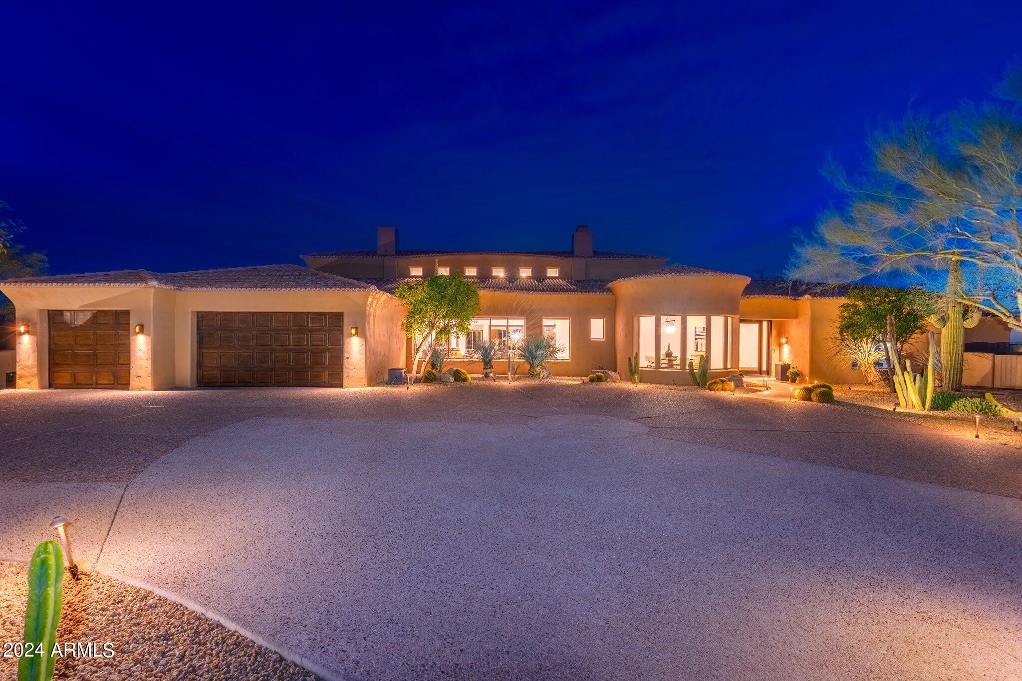 Starting with a truly unrivaled Scullery kitchen .Followed by a genuine resort backyard. Perfectly situated on two generously sized lots, this gorgeous remodeled entertainers dream property of nearly 7200sf with 5 bedrooms 5 1/2 baths is located in the world renowned community of Desert Mountain, with a desirable lower mountain location. The homeowner spared no expense during the full remodel, using only the highest quality finishes one would expect in a home of this caliber. Multiple patio areas, a heated saltwater pool, trampoline, fire pit, and a built in bar-b-que provide ample opportunity for year round enjoyment. An abundance of natural light, vaulted ceilings, and various living spaces, each with unique views of their own, add to the ambiance of living here. An extensive Control4 H Automation System and solar were also added to this property during the time of the extensive remodel. There are no interior steps on the main level, which includes 4b, 4.5b, as well as a designated office space and fitness room. 
The lower level was transformed to the ultimate play space, complete with a bar area, arcade machine, full home theatre, golf and shooting range simulator, and a flight simulator aka Redbird FAA Approved Aviation Training Device. Perfect north south location, that is complimented by a well planned motor court. Privacy and views make this a Truly special opportunity!