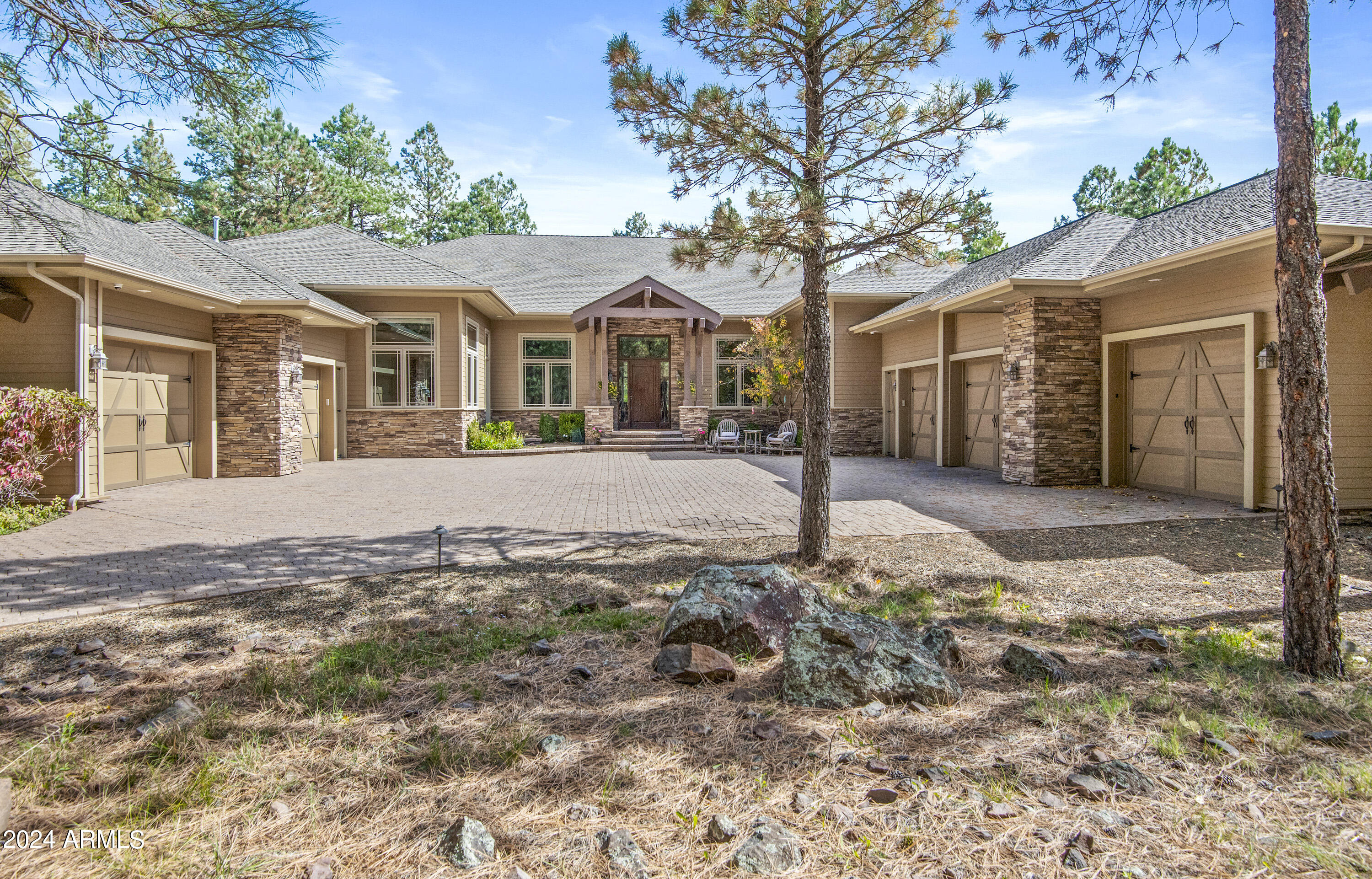 Lot 703 - Discover your dream lifestyle on this exclusive 1.07-acre Meadow homesite nestled in the heart of Forest Highlands. This single-level masterpiece spans an impressive 5,132 square feet and boasts unparalleled luxury and comfort. With 4 ensuite bedrooms, 5 full bathrooms, an open kitchen and living room, and an inviting office space, every detail has been meticulously crafted for refined living. Enjoy breathtaking panoramic views of the #11 green of the prestigious Meadow golf course from the expansive 1600 square foot covered patio designed for seamless indoor-outdoor entertaining. This outdoor oasis features a pool table, built-in BBQ area, and a cozy gas firepit, creating the perfect ambiance for gatherings and relaxation. Inside, experience ultimate comfort with radiant in-floor heating, relaxing sauna, and central air conditioning ensuring year-round comfort in every corner of this lavish home. The 5-car garage with epoxy floors and dual Tesla charging stations caters to the needs of automotive enthusiasts and tech-savvy homeowners alike. Embrace the future with smart home automation powered by a Control 4 system, offering effortless control over lighting, climate, security, and entertainment systems at the touch of a button. This mountain estate is centrally located to the nearby Sports Park which includes fishing, basketball, volleyball, and soccer or just a short walk to the Meadow Clubhouse and driving range.
Tucked away amidst 1,100 acres of pristine alpine beauty, Forest Highlands exudes an unparalleled sense of exclusivity and serenity. With two championship golf courses designed by Tom Weiskopf and Jay Morrish, Forest Highlands sets the stage for unforgettable golf experiences. The community offers an array of exceptional amenities, including two clubhouses, multiple dining options, tennis courts, swimming pools, and miles of hiking and biking trails. Forest Highlands is a retreat where luxury meets nature, ensuring a harmonious lifestyle for its residents.