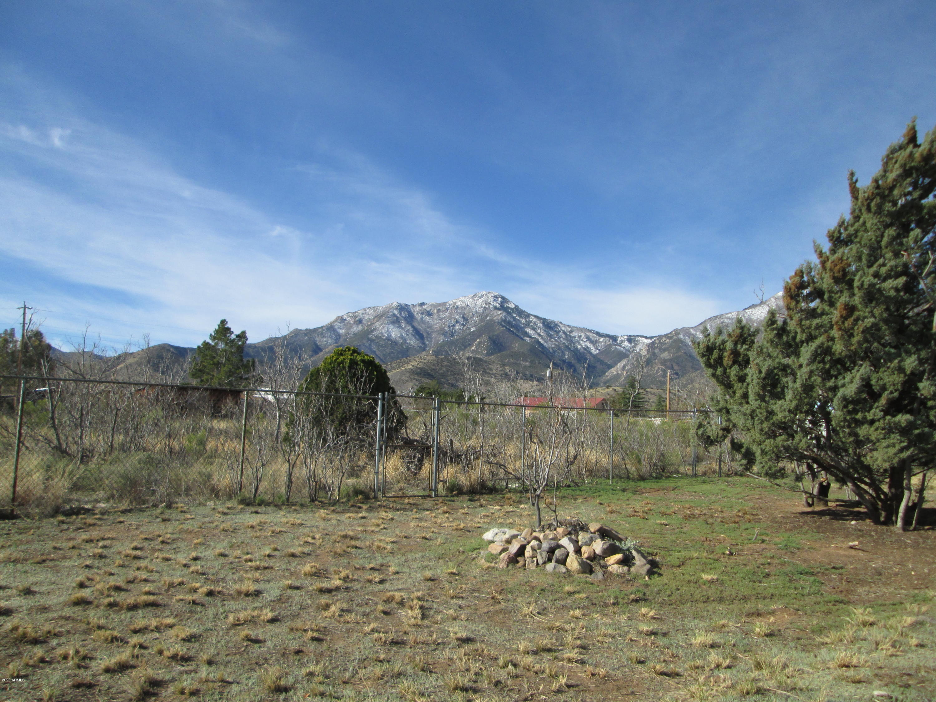 MAJESTIC MOUNTAIN Views! TWO lots FULLY FENCED with 2 pedestrian gates and an RV gate. Concrete slab already on site for a new shed or?? Make an offer!