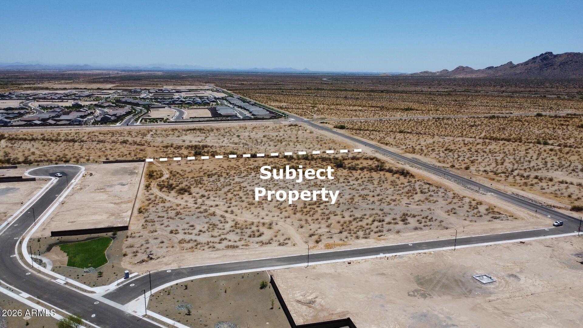 Positioned in the direct path of growth in west Surprise, this ±7.4-acre opportunity borders Century Communities community Rancho Vista, with Mesquite Mountain Ranch directly across the street. The area is surrounded by expanding residential development with city water and sewer infrastructure nearby, creating strong long-term upside potential. Current discussions and concepts have included rezoning for lower density residential, a potential 5-lot split with septic systems, or future commercial development such as storage units. The property has previously attracted investor and developer interest, including a buyer pursuing rezoning plans pending future wastewater capacity expansion. Excellent visibility, strong location, and multiple potential exit strategies make this a compelling buy.