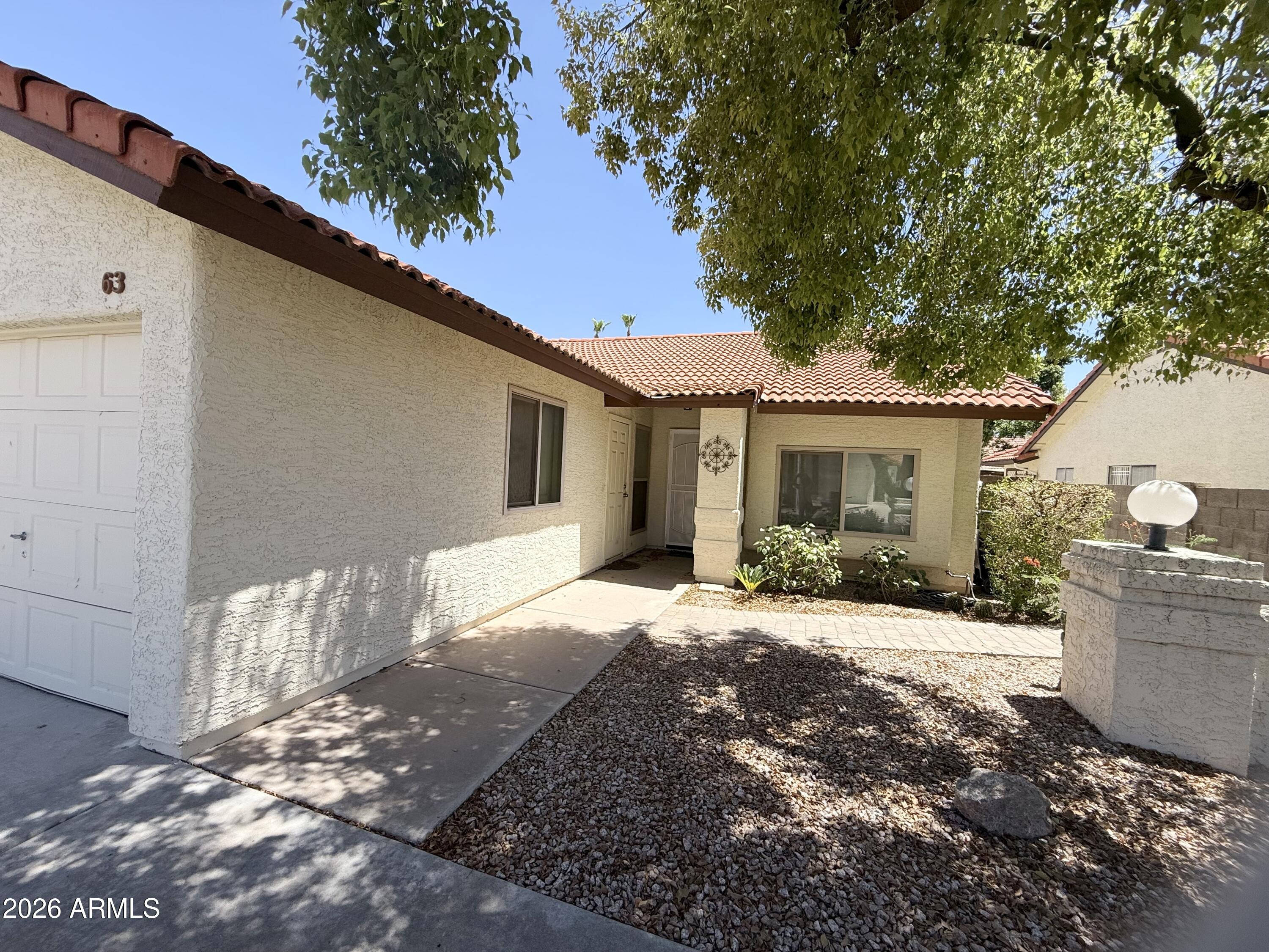 You'll love this adorable N/S sitting townhouse with 2 beds/2 baths, open great room/kitchen and screened in covered patio. The home is designed for easy living with no carpet and artificial grass in backyard. Updated with dual-pane low-e windows throughout, ceiling fans, granite counters in kitchen and bathrooms, and vaulted ceilings. The great room opens right into kitchen with breakfast counter and bay window looking towards charming backyard.  Enjoy the rec center, pool, quiet 55+ community.