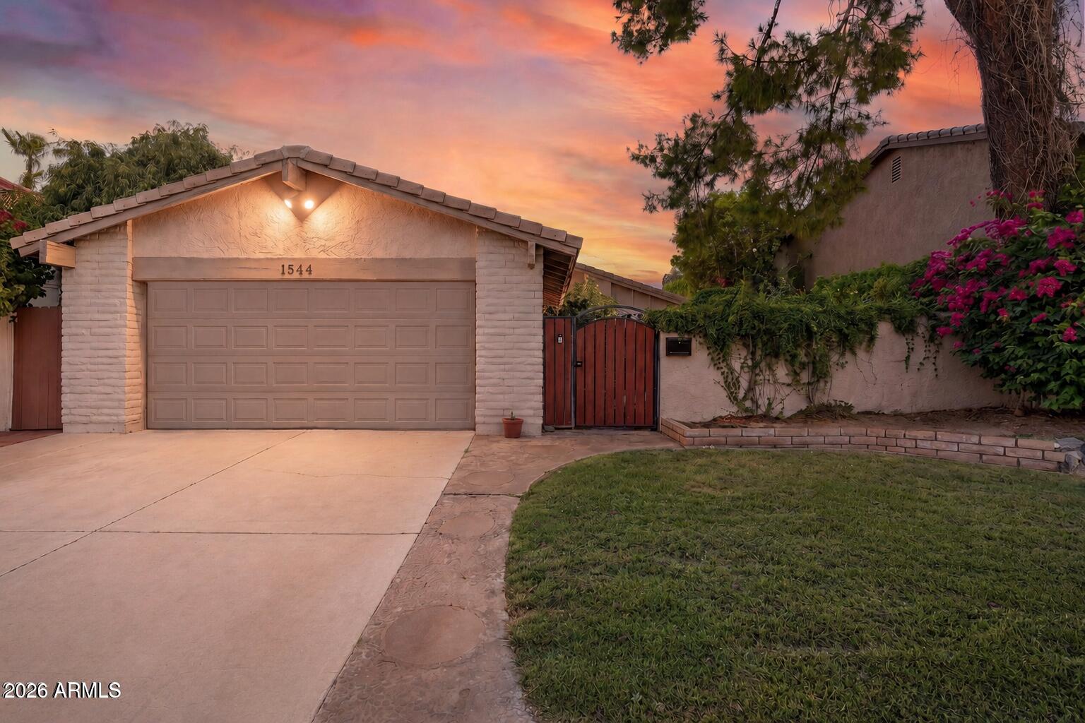Rare opportunity to own a meticulously maintained single-level home in The Lakes, one of South Tempe's most sought-after communities. Thoughtfully cared for with a new HVAC, new kitchen appliances, fresh interior paint ($24k value), and stunning teak hardwood flooring throughout. Multiple sliders create seamless indoor-outdoor living, opening to a private courtyard retreat with a wood-burning adobe fireplace, lush landscaping, and exceptional privacy. Picture the secret garden in the heart of Tempe. Enjoy a serviced gas fireplace, light-filled living spaces, and low-maintenance living. The Lakes offers boating, walking paths, a clubhouse, Olympic pool, pickleball, tennis, basketball, fitness center, and year-round community events. Conveniently located near the I-10, US-60, Loop 101, dining, shopping, and Sky Harbor Airport. You'll love living in The Lakes!