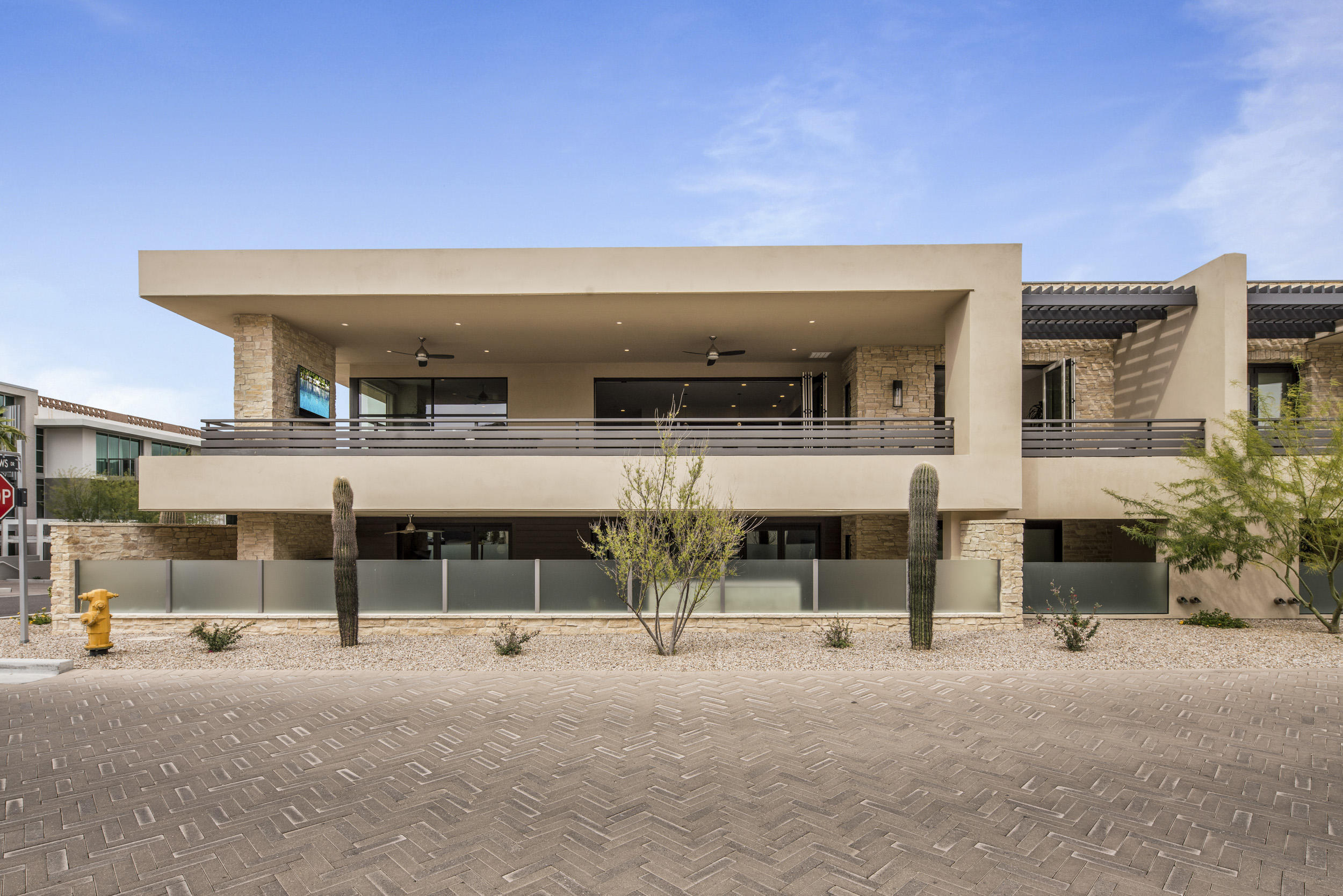 Absolutely gorgeous luxury villa at Mountain Shadows Resort Paradise Valley location! Featuring 3 bdrms, 3.5 bathrms, 2 car private driveway, 2 car private attached garage, private elevator/ stairs to living level, 24 hr. guarded entry, and Camelback Mtn views from the 800+ sq ft. outdoor deck. Enjoy resort-style living with full amenities at adjacent resort with distinct architectural designs. Luxurious designer features include 20 ft. high entry foyer, Wolf combo dual fuel range oven & microwave, Sub-Zero refrigerator, Asko dishwasher, Zephyr hood,  Silestone quartz statuario polished waterfall island & counter tops, 146 bottle Sub-Zero wine chiller, Distinctive cabinets in horizontal grain alder, 10 ft. high ceilings, 9 ft. bi-fold doors to deck, 9 ft. bi-fold from master suite to deck, and indoor/ outdoor fireplaces -- ideal for entertaining!! Very centrally located. Close to all that Paradise Valley & Scottsdale have to offer w/ nearby shopping, fine dining, 5 star resorts, hiking trails, and world class golf. Quick access to either the 101 Fwy or SR51. Easy commute up north or south to the airport.
