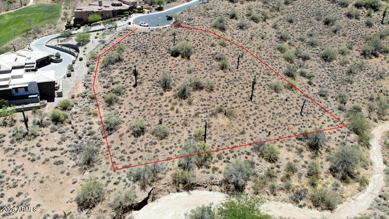 Welcome to the exclusive gated community of FireRock in Fountain Hills, where luxury homes reach multi-million-dollar values.
This premium ''Acre Plus'' lot is ideally positioned between the 1st and 18th fairways, offering a highly desirable north-facing backyard. Enjoy breathtaking, endless views of the  Mountains stretching across the northern skyline.
The site plan features an expansive 19,000 sq. ft. building envelope, providing ample space to design and build your dream home.
Besides golf course Firerock Country Club offers a pool, clubhouse, fitness center, tennis and pickleball courts. This community is central to shopping, and  dinning locations in Fountain Hills and Scottsdale. TPC is 12 miles  away. Buyer to verify all information pertinent to buyer's decision to buy.