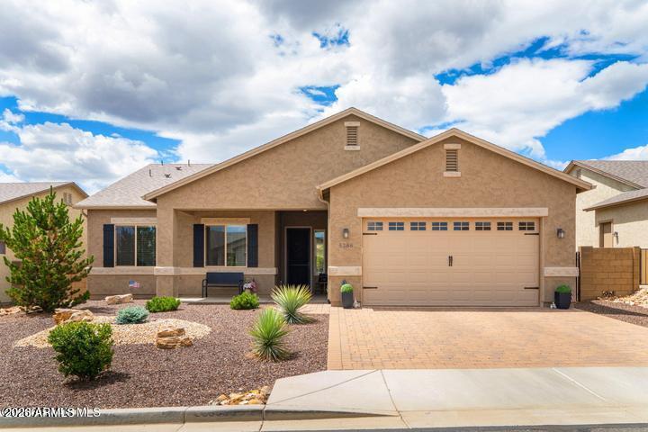 This beautifully upgraded 3-bedroom, 2-bath home in the desirable Granville community is minutes from shopping, dining, medical services, and outdoor recreation. The open floor plan features luxury vinyl flooring, granite countertops, soft-close hardwood cabinets, tile backsplash, new carpet, 9'+ ceilings, tiled fireplace, newer stainless steel appliances, a water softener, and electric shutters. Large windows provide abundant natural light and Mountainous views. The spacious primary suite includes a sitting area, walk-in shower, and dual vanity. Situated on a premium .20-acre lot, the easy-care backyard offers an extended epoxy-coated covered patio, while the oversized epoxy-coated 2-car garage provides extra space for storage or a workshop. Enjoy nearby Spur Cross Clubhouse amenities! look no further! The master bathroom features a spacious walk in shower and double vanity. Unlike other homes in the area, this beautiful and luxurious newer build keeps the 2nd and 3rd bedrooms proportionate in size to the master--allowing guests plenty of space. An easy care backyard space on a PREMIUM LOT features .20 acres of land with an extended length epoxy coated covered back patio makes those spring days peaceful and relaxing; while also allowing plenty of room for a dog run, and planting additional shade / fruit trees! The extended epoxy coated 2 car garage leaves plenty of room for parking multiple long bed trucks while leaving space for a workbench and additional storage options! Granville's fantastic Spur Cross Clubhouse amenities are just up the road and within walking distance; offering an indoor gym, olympic style swimming pool, hot tub, meeting/game rooms, and so much more! Come visit us today and see what makes this home truly remarkable!