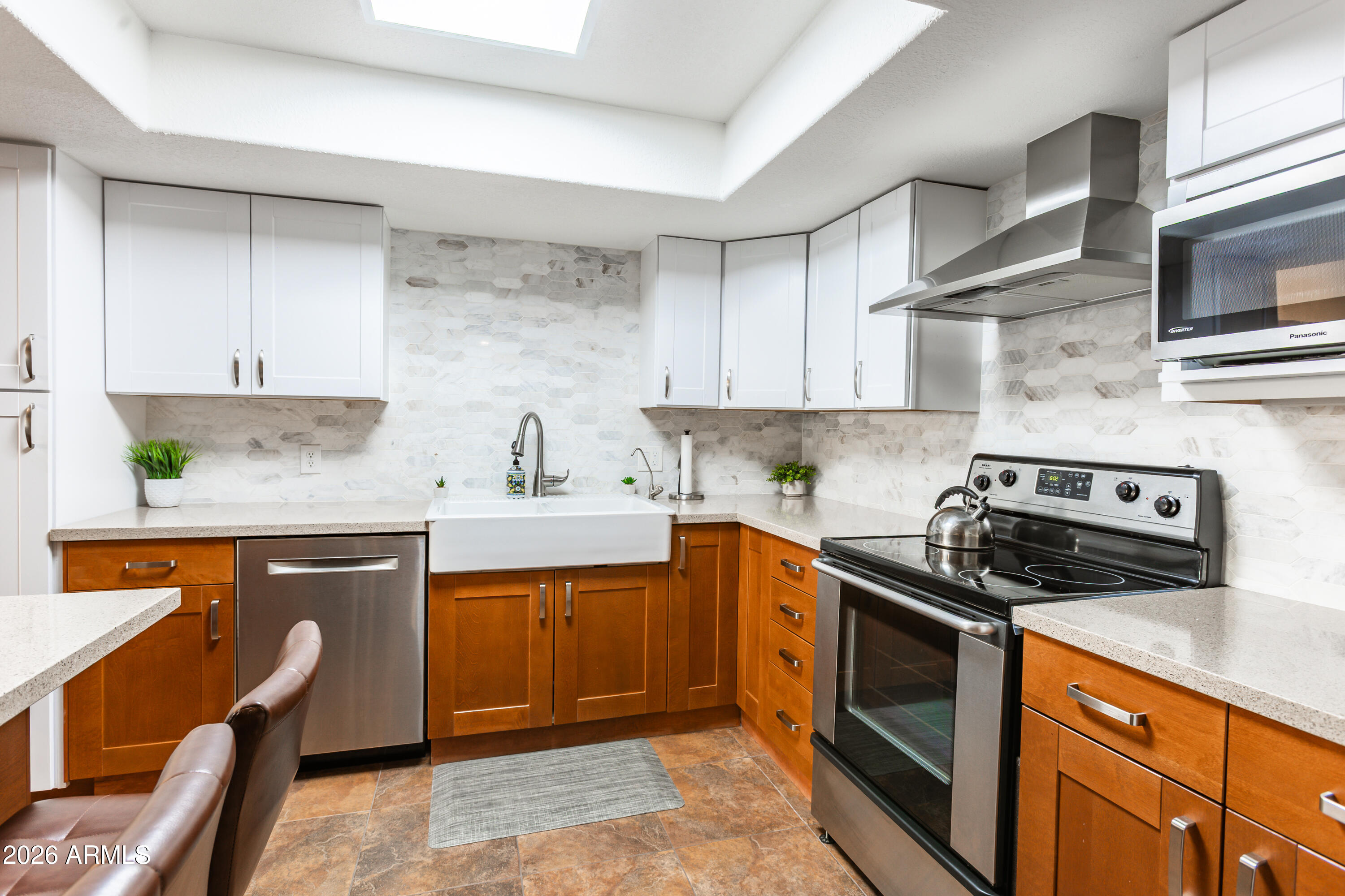 Not all units are created equal, & this one proves it. Unit 102 is a rare ground-floor gem, north-facing for natural light without the Arizona heat, with a shaded patio that opens to the energy of the tennis courts. While there are multiple units available in Scottsdale Shadows, this one stands apart: the current owner invested over $40,000 in thoughtful, high-quality upgrades that go well beyond cosmetic. New double-pane windows throughout provide energy efficiency and sound insulation. Custom shades, closet systems, & added lighting/electric in the bathrooms, closets, and under the sink make every inch of this home feel intentional. The remodeled kitchen features an enlarged floorplan, relocating the fridge to make a coffee/wet bar area, added backsplash, RO that is ran to the freezer, quartz countertops, additional cabinetry added for more storage, a reverse island w/storage so you can entertain and enjoy the tennis views, designer tile, and SS appliances. And because AZ is all about indoor/outdoor entertaining, the seller even added an energy efficient Arcadia door to bring in sunlight and keep the elements out. 
Beyond the unit, Scottsdale Shadows delivers a lifestyle that's hard to match. A private nine-hole executive golf course, three resort pools, tennis courts, fitness center w/Sauna, an art studio, ceramics studio, woodworking shop, billiards ALL included in the HOA, along with AC, heat, water, and trash. You pay one electric bill of what you plug in!  THAT'S IT! 
All of this, just minutes from Old Town Scottsdale, Scottsdale Fashion Square, and the Valley's best dining and shopping. Open to residents of all ages. 24/7 guarded and gated. Under ground garage parking with additional storage closet. This place is well cared for, extremely clean and most of all, Move-in ready.