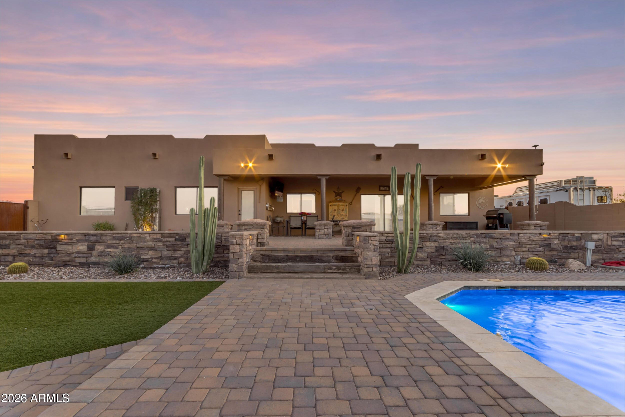 Welcome to an exceptional equestrian estate on the edge of Queen Creek and San Tan Valley. This stunning 3-bedroom, 2-bath custom ranch home combines luxury desert living with a top-tier, professional performance horse facility designed for professional riders and trainers looking to take their sport to the next level but a dream for any equestrian enthusiast.

The beautifully maintained home sits on a spacious property surrounded by breathtaking desert and mountain views. Inside, the home offers a comfortable and functional layout with bright living spaces, quality finishes, and seamless indoor-outdoor living. Outside is your own private resort-style backyard, where relaxation meets entertainment. Enjoy a large sparkling pool, custom hardscaping, outdoor seating areas, fire feature, and a putting green- perfect for entertaining guests or unwinding under Arizona's incredible sunsets.

Equestrians will appreciate what truly sets this property apart: a high-quality professional performance horse setup. The facility is thoughtfully designed with the highest quality materials for functionality, safety, and efficiency. Top of the line metal and welding is found throughout the property but the barn and tack room highlight the thoughtful and modern design. With oversized stalls, multiple turnouts, cow run and a well-lit large arena space ideal for training and riding year-round. An automated gate and shoot designed to move cattle singlehandedly- roping with just your partner is easy. This property has hosted several sponsored roping events with 5-star reviews. Whether you are a competitive rider, trainer, or just a horse enthusiast, this property provides the highest quality infrastructure needed for a serious equestrian operation. There are even RV hook ups for income producing opportunities that are rented to equestrian snowbirds looking to train throughout winter.

The property offers wide-open space, excellent access, and room for trailers, equipment, and expansion while still being conveniently located near the amenities of Queen Creek.

This is a rare opportunity to own a turnkey equestrian property that blends luxury living with a the most thoughtful and quality performance horse operation found on the market today. Truly too many upgrades and features to list. Owner may be willing to carry the loan- the perfect opportunity for aspiring trainers!!