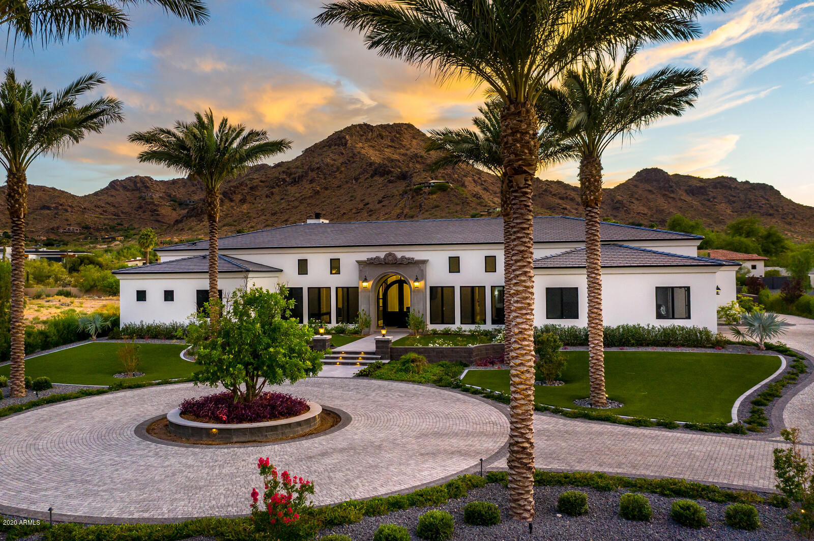 Quality Built in every way, all by design, not by luck. Engineered to handle proper monsoon season rain water, its premier walls are built by solid block, limestone fireplace, stone entryway, homes exterior walls are smooth finish masonry EIFS, provides more protection and insulation than traditional stucco; double thick felt roofing, yet elegant and stylish interiors. Comfortable and Iconic, captures views from every window and doors. Nestled at the base of Mummy Mountain, on an acre, privately Gated grounds, offering split floor plan, 5 bed, 6.5 baths, Crestron home automated system, dual tankless water heaters, a 580 sqft detached Pool/Clubhouse that offers a full BBQ Kitchen and wet bar all by opening it up its by-folding doors and windows. Room to add on to the pool house or RV garage Inside, white Thassos Greek marble and black granite floors, luxurious dual master suites and closets, top of the line chef's kitchen, 5 Swarovski Crystal Chandeliers. The private resort style backyard features a gorgeous pebble sheen saltwater pool and spa, custom fire place, jaw dropping Mummy Mountain views and sitting areas. The List of Features and Benefits is available under the Document Tab. See our 3D Virtual Tour motion Motion Video!