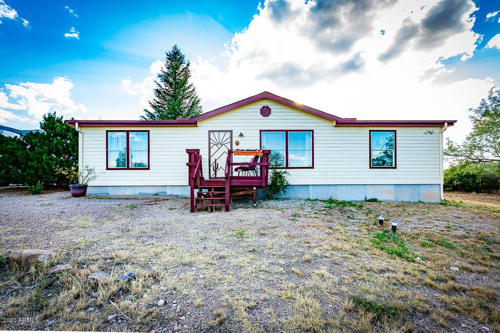 Don't miss this beautiful three-bedroom Pacesetter manufactured home!  Conveniently located on one acre just south of Sierra Vista.  Featuring an additional two rooms of heated/cooled space added onto the garage, for use as guest rooms, office space, hobby space, He-Shed, She-Shed... whatever!  Enjoy spectacular views from the covered patio, and relax in the above ground spa. This home is truly a gem just waiting for you to enjoy!