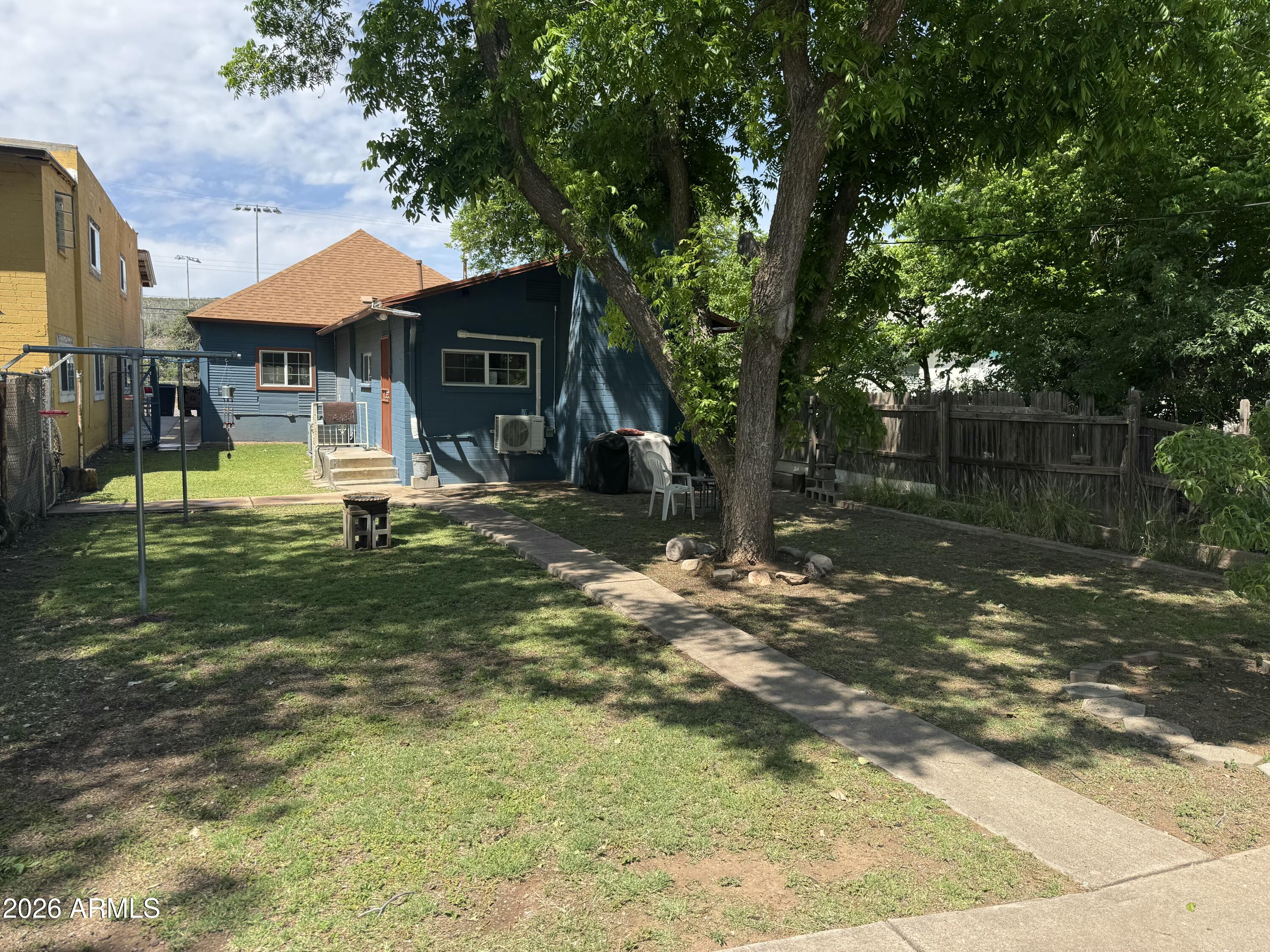 Detailed, clean and efficient, 3 bedroom, 2bath, 1,603 sq'. Updated electrical, new panels and sub panels for house and shed. Fall of 2024, newly painted inside and out, all newer appliances, including a mini-split, flooring, kitchen counter tops, toilets and tile. 2022 shingle  roof, and windows. Large rooms, AC, natural gas heat and a wood burning stove in the back room. Large yard, with drive through rear gate, RV access. Covered area on one side of shed could fit a smaller vehicle, shop/storage attached and RV parking. Freshly poured concrete parking pad and sidewalk on the side of the house. Parking, level, a couple of stairs out the back door and easy walk to the Vista, food and hardware store.