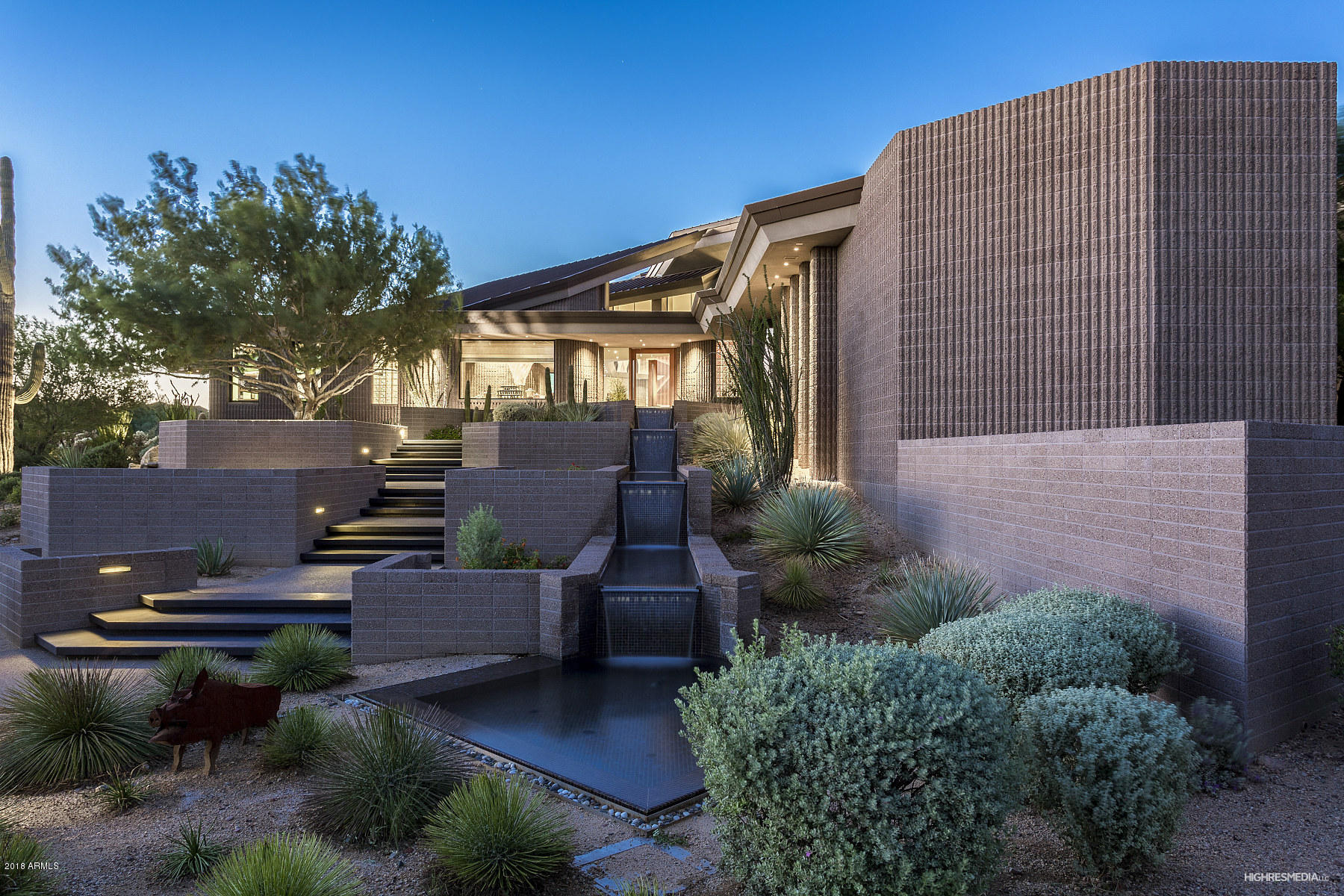 A special combination of location, design and construction. This Award winning home sits perfectly on a flag lot on the 17th hole of the DC Ranch Country Club. A masterpiece was created by renowned architect Vern Swaback and Kitchell Construction. Every element of this home was artfully designed and built. From the custom cabinetry created from hand picked logs to the floating  block walls, everything you see is magical. Walls of windows allow for views from all angles of the house. City lights, mountain views and beautiful golf course views are all included. A glass surrounded sitting area in the master bedroom allows for easy access to the private master suite spa.  Wonderful great room concept ties kitchen, living space and formal dining perfectly.