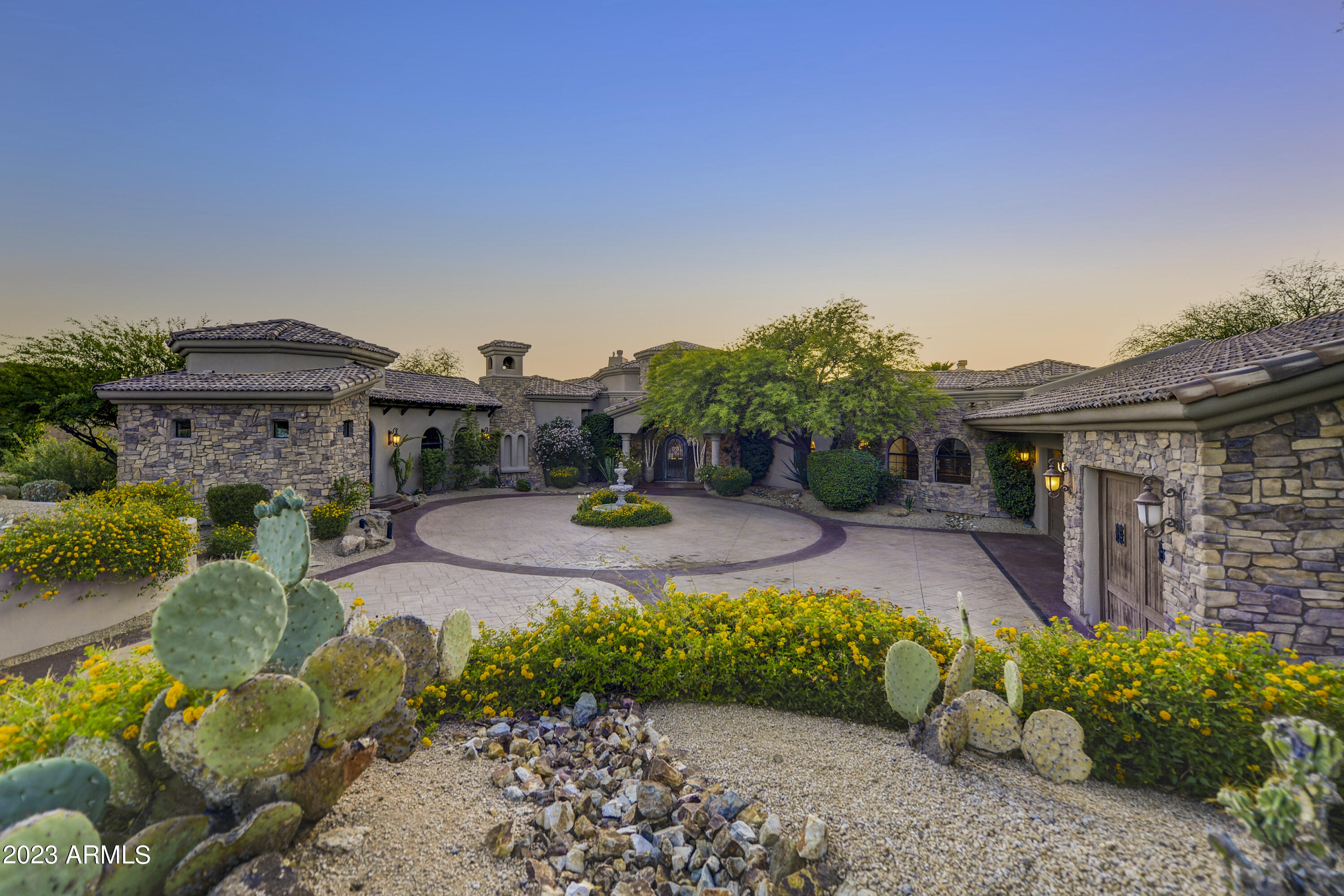 Located inside the Golf Gated Community of Talus in Troon North and situated on 1.12 acres, this residence backs up to the preserve and offers Sunset & Mountain Views. Access the Private Motor Courtyard and you're welcomed to stately Wrought Iron Glass Door entering into open floor plan Family and Dining Rooms with 4-pane glass wall, 5 bedrooms, 5.5 Baths, custom stone Fireplaces, Pillars and Wet Bar. Enjoy the Custom Cabinets, Granite & professional grade appliances in the generous Kitchen. Office has custom built-ins. Bonus Room can easily double as a Media Room. Don't miss Private Guest Casita! Private Backyard includes an oversized covered Patio, saltwater Pool/Spa, multiple Water Features, putting green, Fireplace, and outdoor Kitchen. Don't miss floor plan and Motion Video!