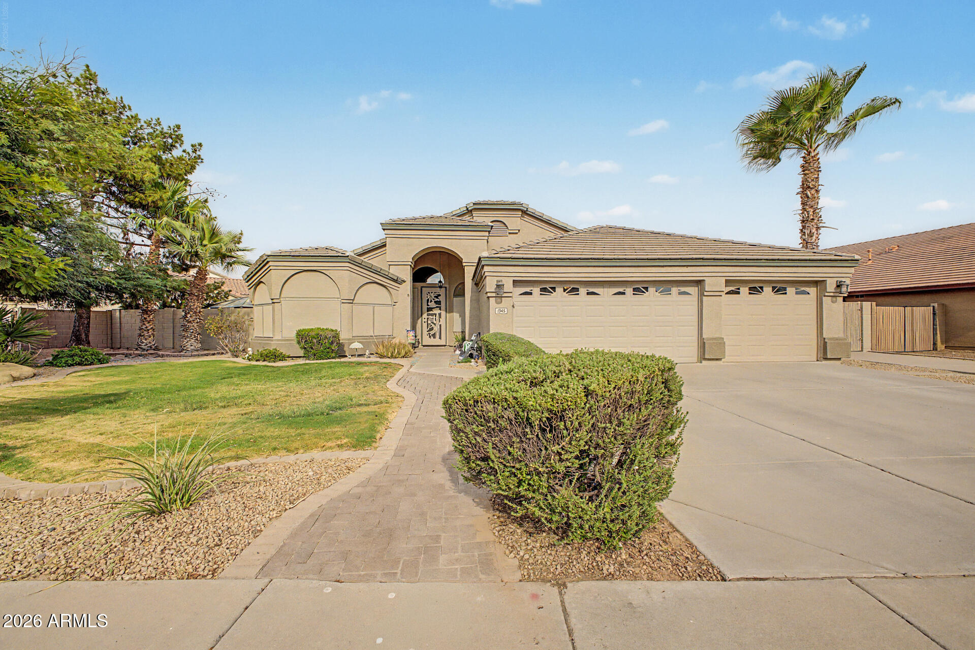 This beautifully maintained single-level home offers a bright open floor plan with vaulted ceilings, 3 bedrooms, a versatile den, 2 bathrooms, and a spacious 3-car garage. Situated on an oversized lot of more than 10,000 square feet, the backyard features a sparkling PebbleTec pool, an extended covered patio, an RV gate with a concrete slab, and additional parking. Inside, the well-appointed kitchen features upgraded cabinetry and brand new appliances in 2025. The spacious primary suite offers a private retreat with dual sinks, a separate soaking tub and shower, and direct access to the backyard. Recent updates include new ceiling fans on the patio, in the bedroom, and in the office, as well as new garage doors installed in 2024, making this move-in-ready home an exceptional find.