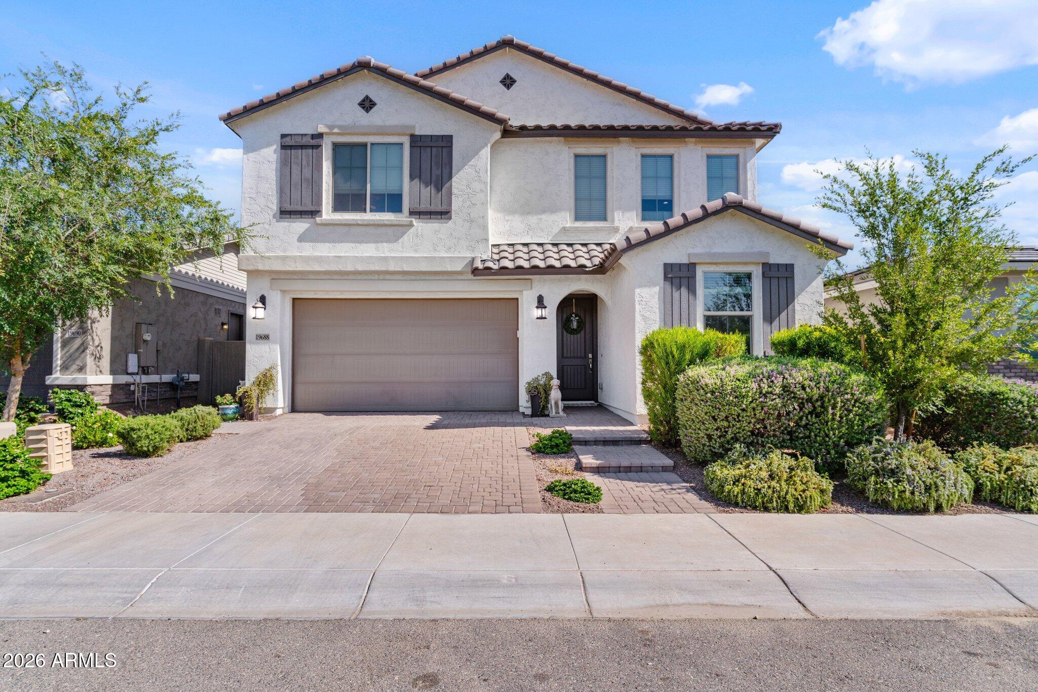 Located in the coveted Verrado community with a Litchfield Park address, this impeccably maintained 2020 built home offers the feel of new construction with thoughtful upgrades throughout. Featuring 4 bedrooms, 2.5 baths, downstairs office/den, upstairs loft, AND fully OWNED SOLAR, this property blends style & efficiency. Filled w/ natural light and features designer tile flooring and a gourmet kitchen w/ quartz countertops, white shaker cabinetry, stainless steel appliances, & oversized island ideal for gathering. The backyard was designed for privacy and Arizona living w/ pool, turf, covered patio, and no 2-story homes behind. All set within Verrado's award-winning master-planned community offering parks, pools, trails, dining, cafes, farmers markets, & everyday conveniences moments away
