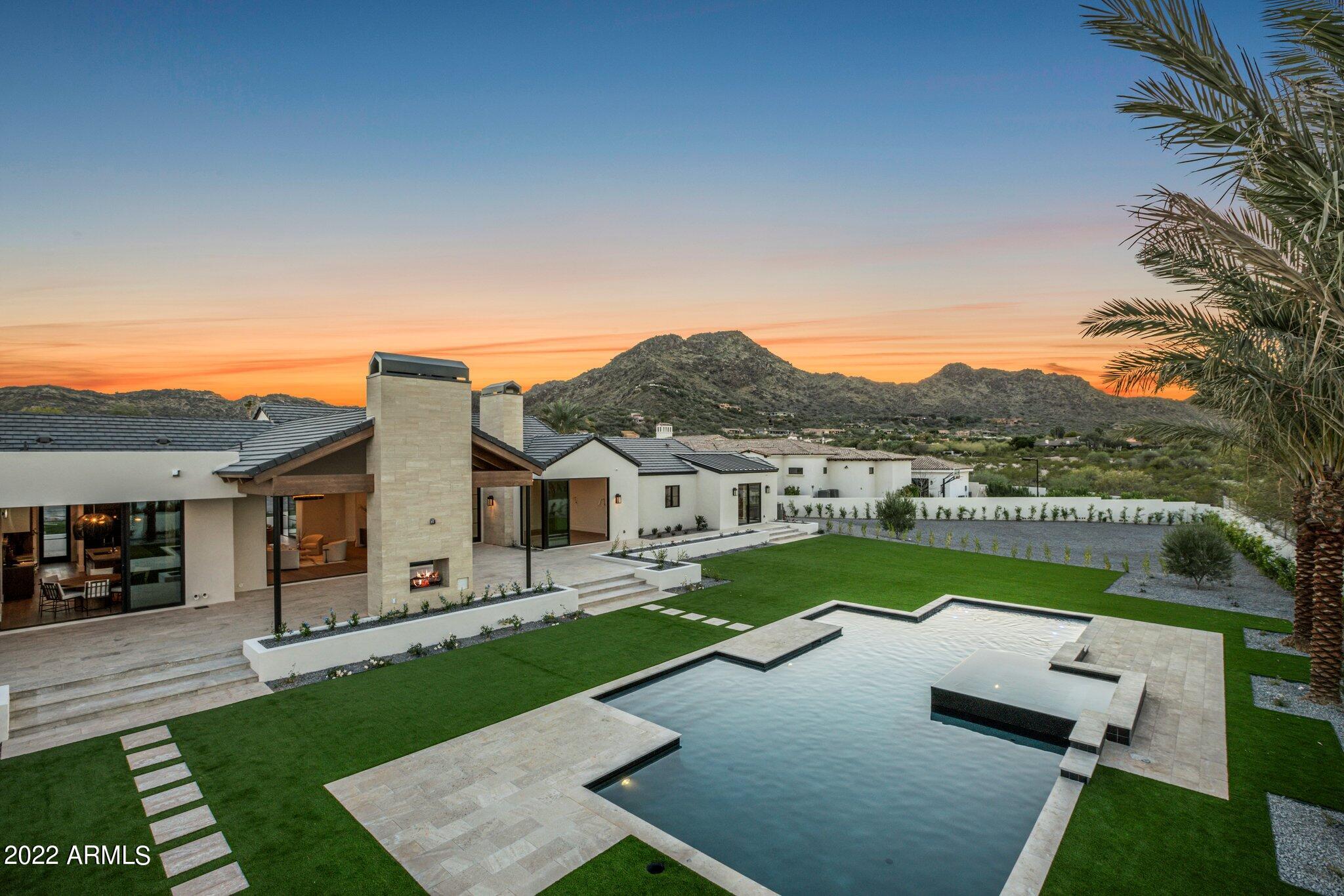 Luxury Paradise Valley new build. This home is an entertainer's paradise with an open floor plan, indoor/outdoor living, stunning views of Mummy Mountain, & guest suite that includes a kitchenette & exterior entry. This quality build boasts luxury finishes, high energy efficient systems for minimal air loss, smart home technology, and high end appliances. Top of the line custom chef's kitchen by Kings Cabinetry & butler's pantry featuring Sub-Zero, Cove & Wolf Professional grade appliances. Caesar stone Kitchen Counters. Kitchen area features appliance garage, built-in Coffee Maker & 60 bottle Sub Zero cooler. Dry Bar off the Dining Room. Neolith Great Room Fireplace. 8 Security Cameras installed. SONOS speakers in Great Rm, Kitchen & Exercise.  Pre-wired t/o. Water bug leak detection t/o. Pre wired for window break protection.  Western Windows. Self cleaning heated pool, 5' depth. Quartz floors in entry. European White Oak engineered wood floors. Travertine Patio floors. Porcelain floors in Master bathroom w/ Quartzite countertops. Push-In master bathroom cabinets. 3 person Jacuzzi sauna in exercise room. Dedicated outlets. USB outlets. Quartzite Laundry countertops & concrete laundry room floors. Gas Range, Fireplaces, BBQ & Pool/Spa heater. 5 A/C Units.