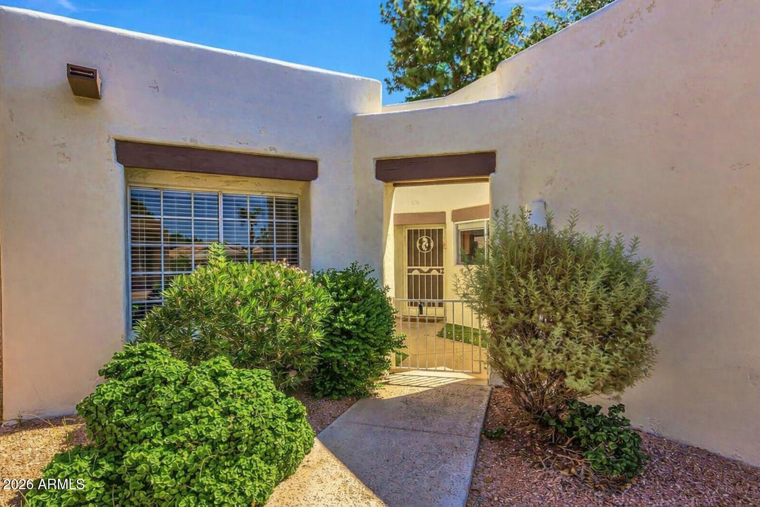 Welcome to resort-style living in the guard-gated 55+ community of Sun Village! This beautifully maintained 2-bedroom + den home features an open-concept floor plan designed for comfort and easy entertaining. The spacious primary suite offers a rare private exterior entrance to the covered patio and fenced backyard--perfect for enjoying Arizona's beautiful mornings and evenings.

Ideally situated next to a lush greenbelt and just moments from two recreation centers, this home places you right in the heart of the community. Beyond the gates, you're less than a mile from shopping, dining, and the Surprise Stadium, home to Major League Baseball spring training.

New HVAC system installed in 2023, this is an impeccably maintained property. Sun Village offers an unmatched active lifestyle with an array of amenities, including a scenic golf course, sparkling pools, tennis and pickleball courts, lakes, and a vibrant social calendar filled with clubs, events, and activities. Residents also enjoy access to fitness facilities, a billiards room, woodshop, arts and crafts studios, sewing room, library, and more.