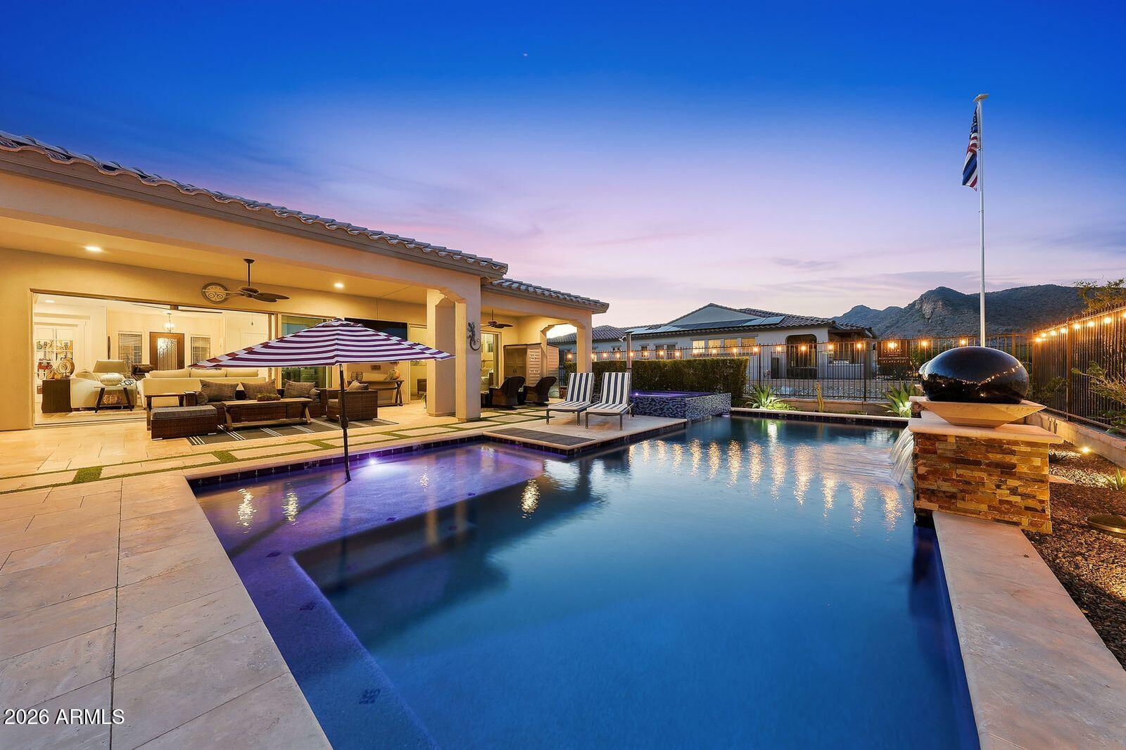 Experience resort-style living in David Weekley Serendipity model, perfectly positioned on Victory's hole #12 with fairway and mountain views. Impeccably maintained, this home showcases a sophisticated neutral palette and designer upgrades throughout. The gourmet kitchen features GE Cafe appliances, a gas cooktop, double ovens, Kings Bottle beverage fridge, wine fridge, and an oversized walk-through pantry. The open-concept great room is ideal for entertaining. Offering 3 bedrooms, including 2 guest suites with ensuite baths, plus a private office with glass French Doors. The luxurious primary suite features a large slider, custom closet, soaking tub, and walk-in shower. Outside, enjoy an entertainer's backyard with a pool, spa, and outdoor kitchen. Complete with a 3-car garage. Now step outside to an entertainer's dream backyard with a resort-style pool and spa, pergola with a built-in outdoor kitchen with BBQ cooktop, 2 cook-top burners, beverage fridge, sink, and more. There are multiple gathering spaces ideal for hosting, including an extended covered patio and a built-in fire pit. A tricked-out 3-car garage completes this home. A must-see to appreciate this move-in-ready, exceptional home!