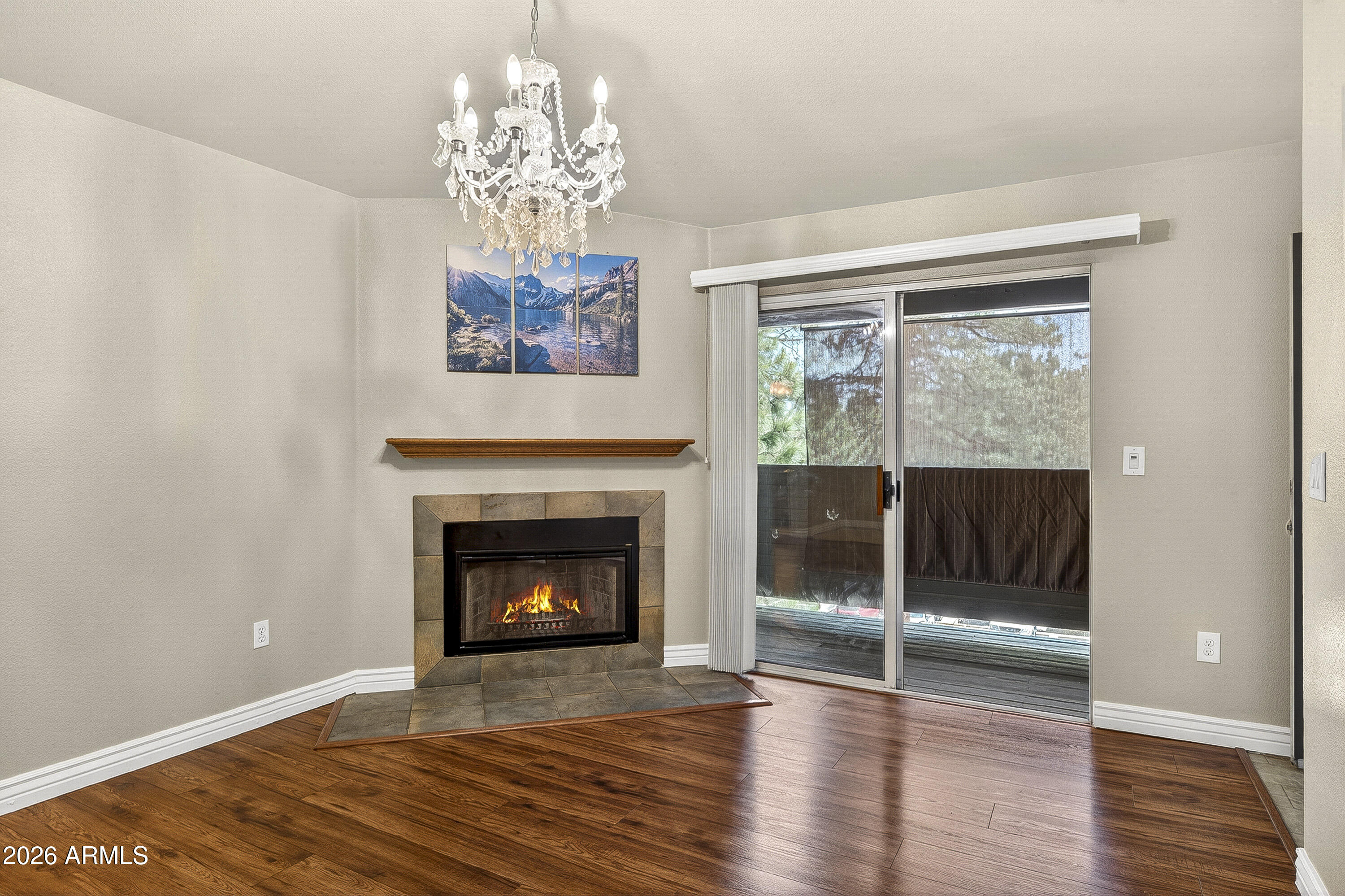 Rare upstairs end-unit condo with Ponderosa Pine views, a cozy wood-burning fireplace, and excellent investment potential in the heart of Flagstaff! This 2-bedroom, 2-bath home offers privacy and comfort with a recently painted private deck, newer laminate flooring with added sound barrier, updated baseboards, fans, chandelier, touch-up paint, and a new thermostat. The kitchen features a new refrigerator, range, and convenient 2-in-1 washer/dryer. Covered parking spot #70 conveys with the property! Located near NAU, shopping, dining, and entertainment, residents enjoy access to clubhouses, fitness facilities, jacuzzi, grills, study room, and gathering spaces. HOA includes water, sewer, and trash.