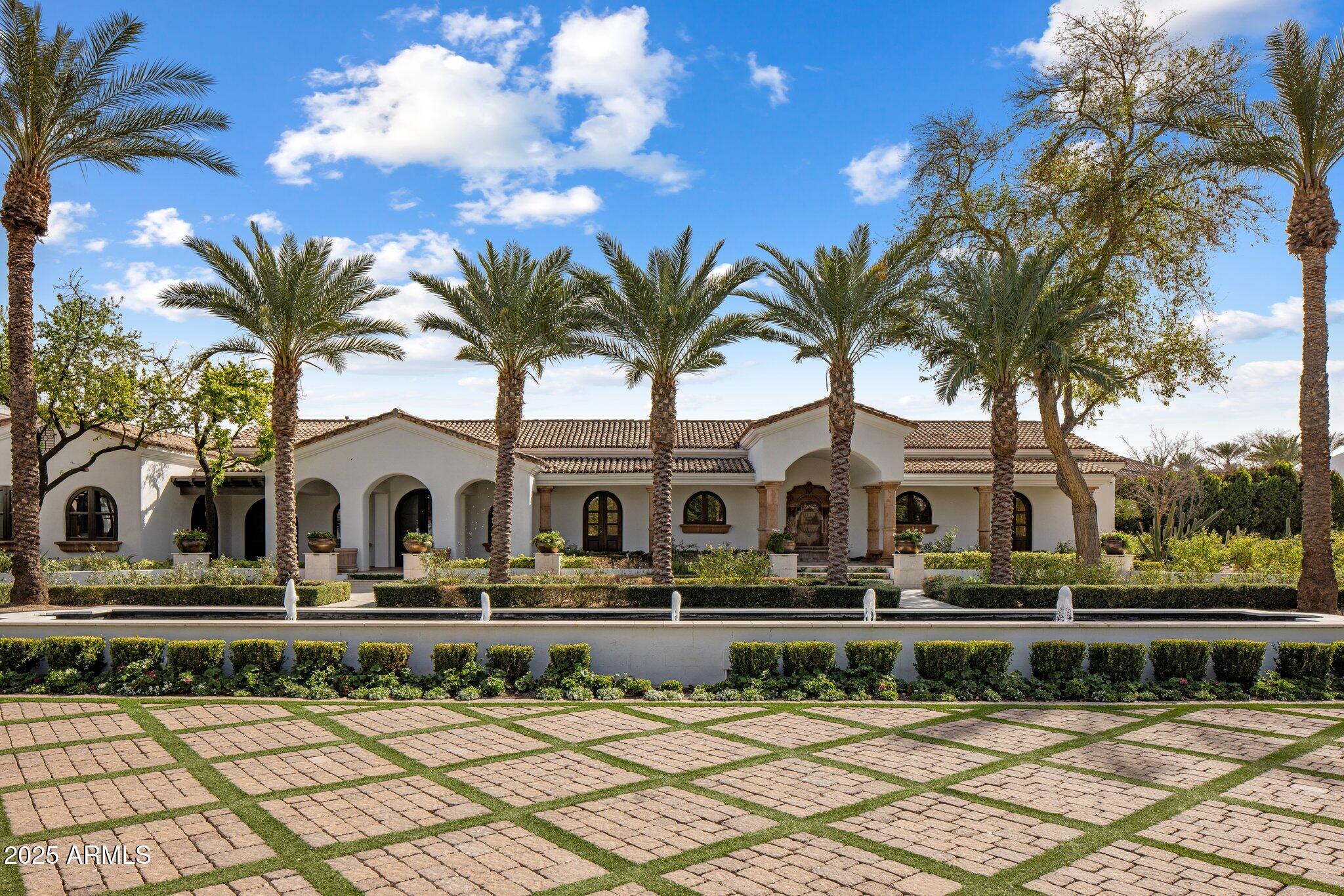 The sellers are ready to share this home, an estate on private luxury dirt. Dual entrance , gated and monitored for security. Six car temperature controlled garage with the largest residential solar rooftop.   Landscape designed to be green and flower year round with many trees . Think Central Park, not Palm Springs. Chefs outdoor kitchen with bar has a living room feel  and is poolside.    Then the Home- warm and welcoming with all the rooms one would expect. Game room, Wellness room with gym, office, library, casita and all bedrooms ensuite. The primary suite has 2 of everything and so much more. This estate must be experienced personally to appreciate.