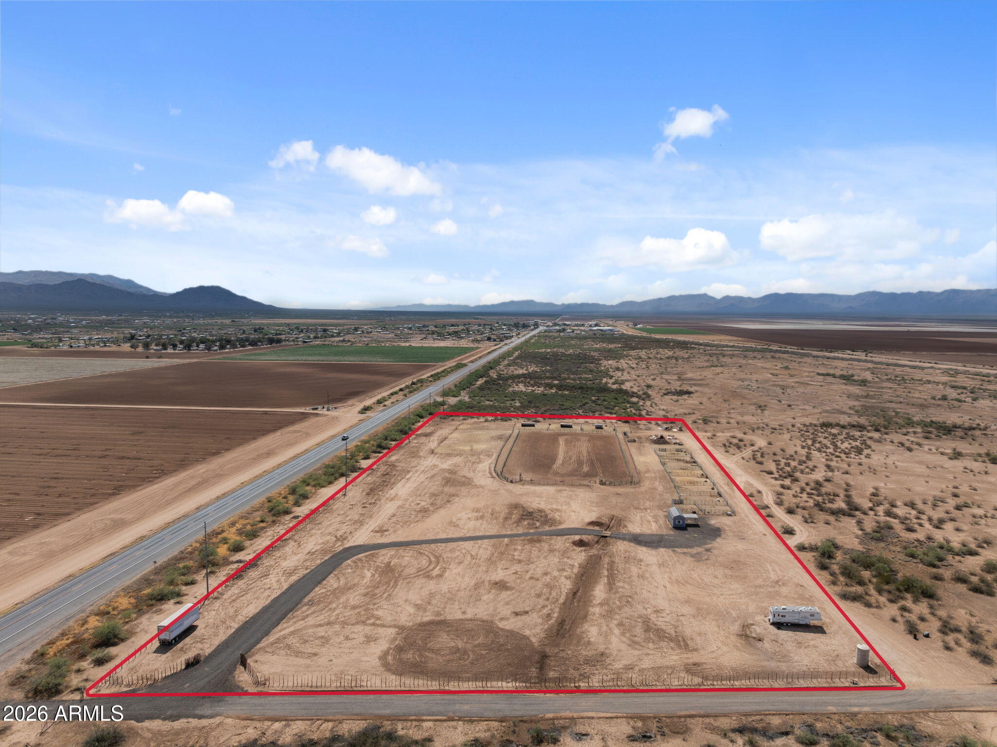 Situated in a desirable horse area with direct access to nearby State Land, this fully fenced 10-acre property offers level, usable ground with endless potential for horses, cattle, or future improvements. The property features a private well w/ a 2,000-gallon storage tank & a crushed asphalt road leading into the property for access.Current improvements include water lines ran, 4 calf pens w/ shelters, & a full-size 200'x275' arena w/ a return alley allowing you to rope in either direction, ideal for calf roping, breakaway, or team roping & tack shed with cover. With plenty of room to expand, add additional improvements, or build your custom dream home and horse setup, this property offers flexibility and opportunity in a great location