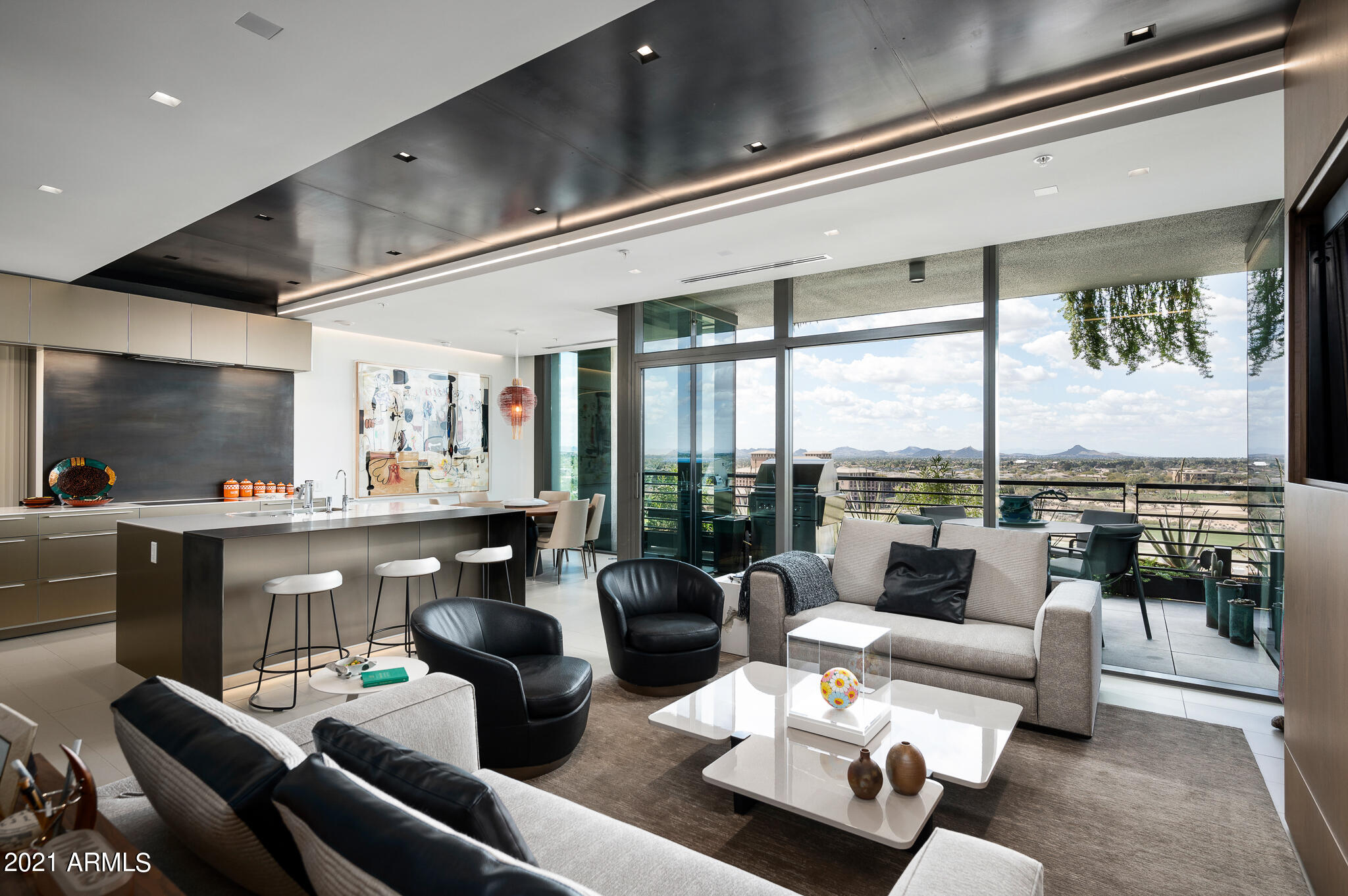 Drewett Works Architecture and Ownby Design teamed together to create one of the finest penthouses in Optima at Kierland * Unobstructed sunset, golf course, city light, and mountain views * The finest streamline finishes include forged steel accents and fixtures, custom cabinetry, and designer lighting created by Robert Singer * Full Crestron home automation including motorized sun screens and blackout shades * Rare to find 3 bedroom with 3.5 bath, office, 10ft ceilings, dual patios and 2 storage rooms *