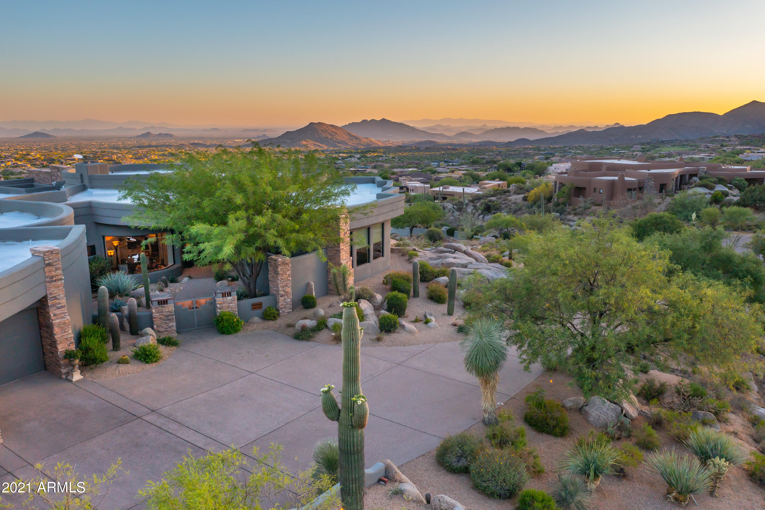 Welcome to the top of the Mountain.  This amazing Lee Hutchinson design is perched high in the Village of Sunset Canyon to offer some of the best panoramic views in all of Desert Mountain.  Warm and inviting, this Desert Contemporary home welcomes the ultimate in indoor/outdoor living while providing splendid refuge from a cool winter night or an approaching monsoon storm.  The 3 bedroom 3.5 bath layout features serpentine hallways leading to enchanting living spaces.  The owner's suite offers picturesque vistas of the layered mountains to the west.  A grand 5 car garage provides ample space for the sports minded or the car enthusiast.  Approved plans for a fourth bedroom guest casita await the owner seeking to add additional living quarters.
