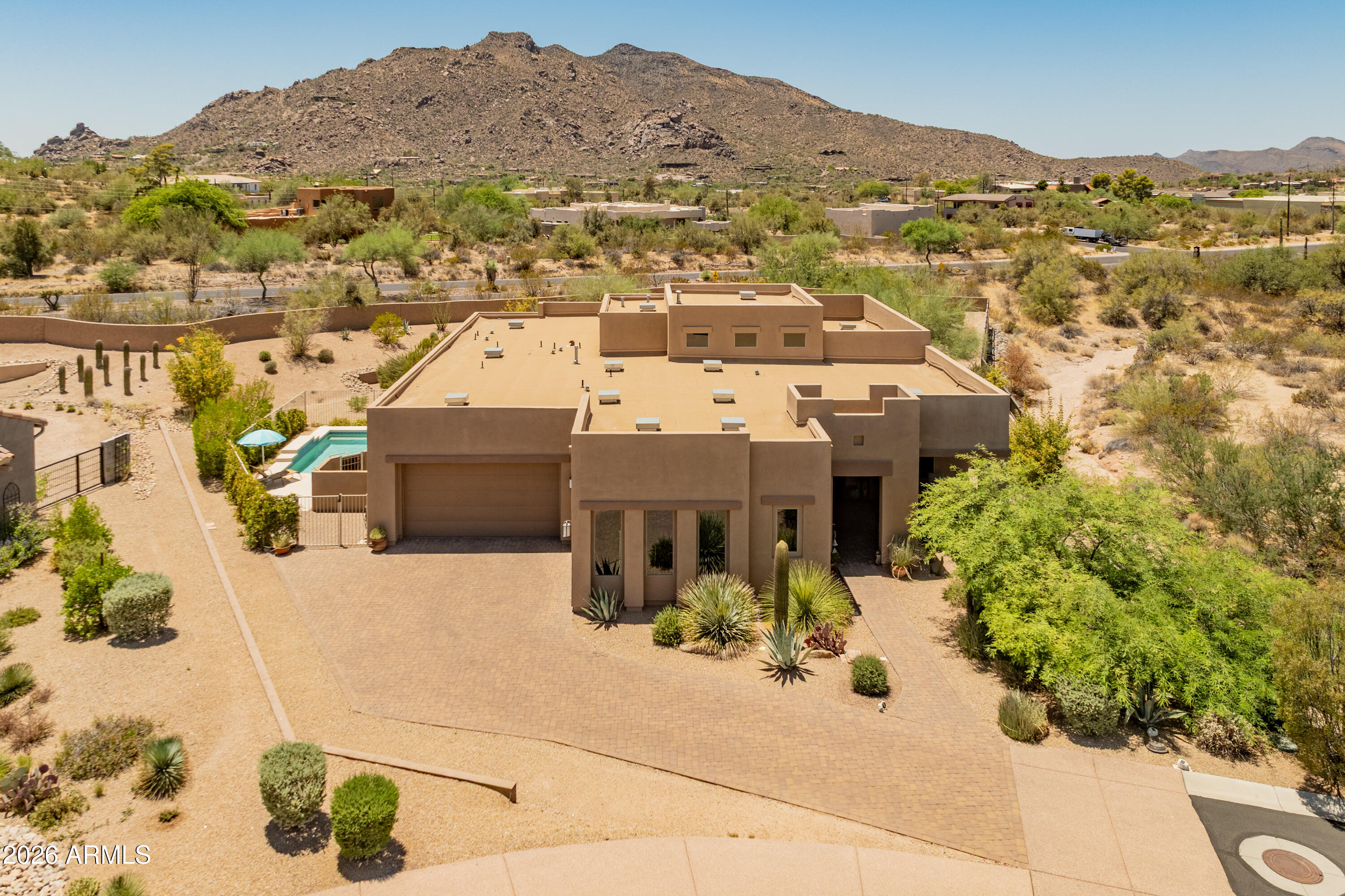 Experience Arizona luxury living in the prestigious gated community of Reserve at Tranquil Trail. Perfectly positioned on a sprawling ¾-acre homesite, this stunning residence captures breathtaking panoramic mountain views & unforgettable Arizona sunsets. Thoughtfully designed with 3 bedrooms, 3 baths, a private office & an oversized 3-car garage, this home offers an ideal blend of elegance & comfort. The chef-inspired kitchen showcases leather-finished granite countertops, KitchenAid stainless steel appliances & exceptional prep space for entertaining. Beautiful tile flooring flows throughout, while a gas fireplace creates a warm, inviting focal point in the great room. Step into your resort-style backyard featuring a sparkling heated pool, expansive outdoor living areas & endless views that make every day feel like a vacation. Ideally located just minutes from the renowned Sun Dial Plaza, where upscale dining, shopping & entertainment await.