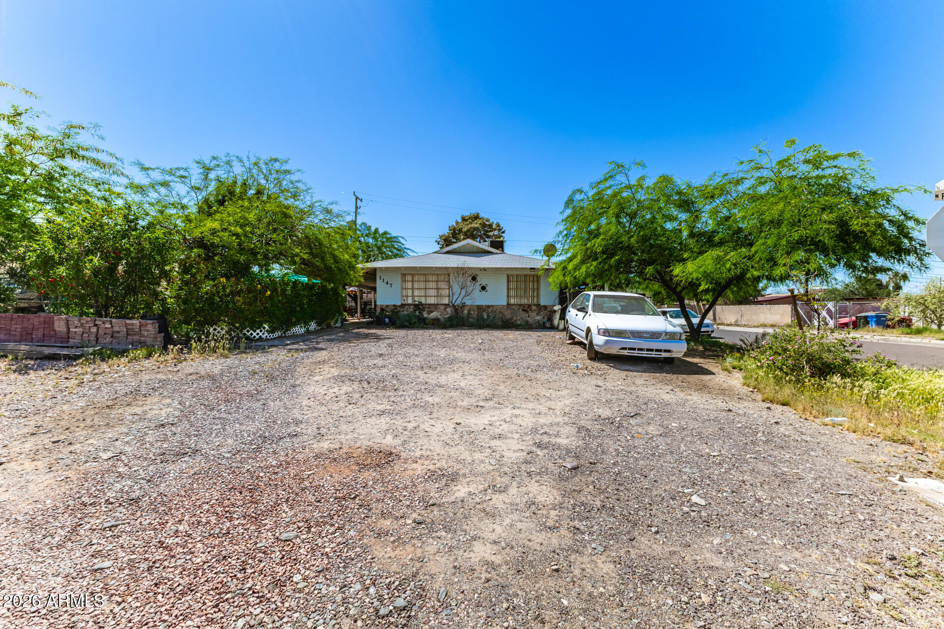 Take advantage of this fantastic investment opportunity with this charming duplex on a desirable corner lot! Each unit features a cozy living room with a soothing palette, blinds, and tile flooring. Both eat-in kitchens are well-equipped, ready for culinary adventures. All bedrooms are cozy and well-sized, providing inhabitants with a private retreat for a good night's sleep. Outside, you'll find a full-length covered patio with well-laid pavers, perfect for enjoying a good book or a refreshing drink. Don't miss out on this one!