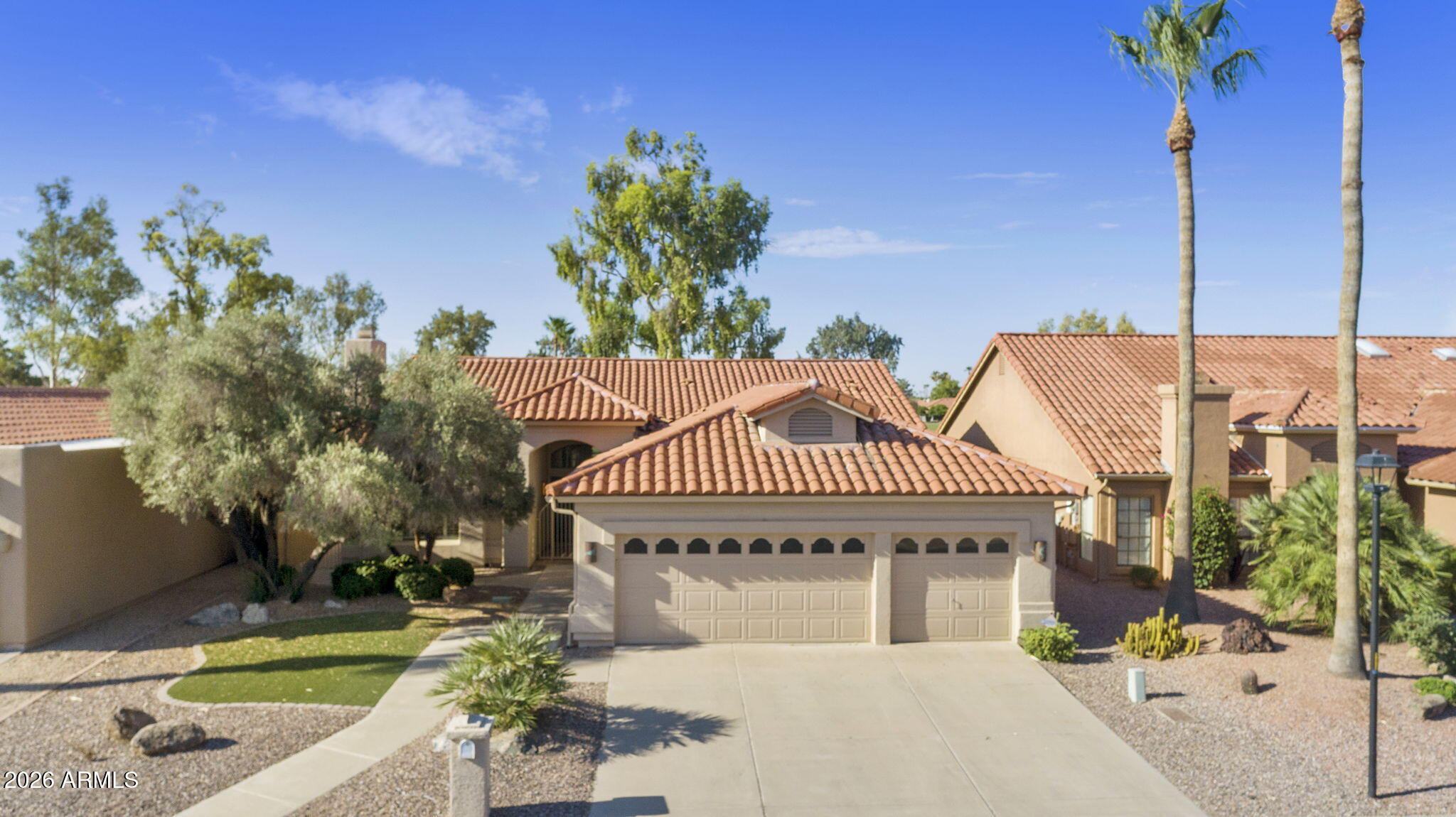 Nicely updated 2BR, 2.5BA plus den Galleria model w/great curb appeal on the golf course in the gated active adult community of Palo Verde at Sun Lakes. Beautiful new ceramic plank tile flooring throughout most of the main living areas. Entertainer's kitchen with painted cabinets, granite counters, SS appliances adjoining the spacious family room with golf course views. Huge primary suite w/patio access, fully updated dual sink bathroom with tiled walk-in shower and soaking tub, and his/hers walk-in closets. Updated spare bathroom with stunning walk-in shower. Extended, pavered, south facing covered patio with open golf course views. New roof in 2024. 3-car garage. Start enjoying the many amenities of Palo Verde including golf, tennis, pickleball, fitness, walking paths and so many clubs!
