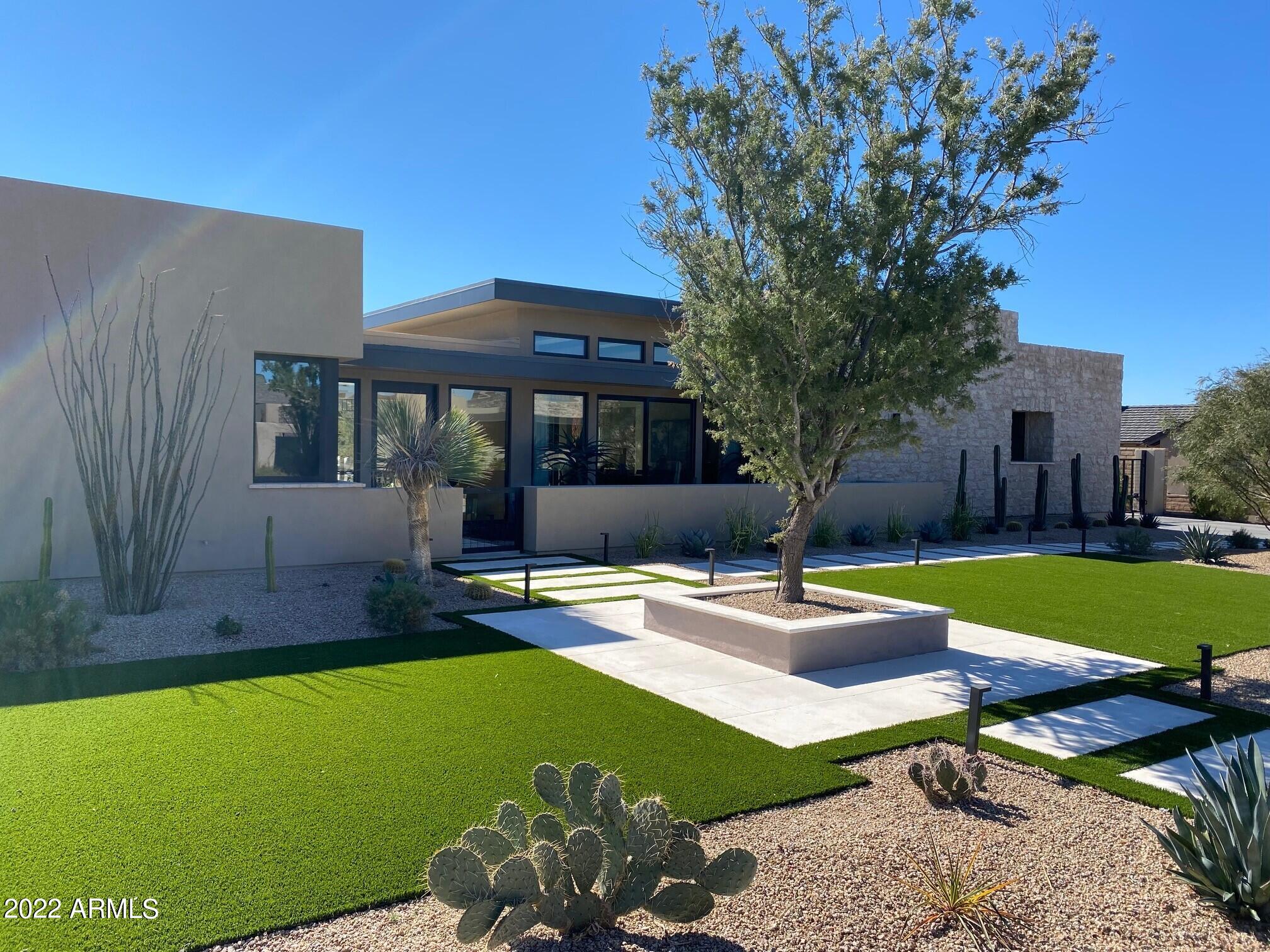 Gated Whitehorse in North Scottsdale. Situated perfectly on one of the top sites in the community, this Camelot-built home caputures views of mountains and city lights.  This courtyard-style layout features 3 bedrooms, an office and game room- plus a separate entry guest casita.  Significantly updated: stone wall accents, wide plank wood floors; quartz and marble countertops,  wolf/subzero appliances, Savant home automation system and private driveway gate.   Ideal for entertaining with 6 sets of stackable glass walls that open up to the courtyard and patios throughout the home, plus a game room with full bar and 2 TV's.  Beautifully landscaped property features a courtyard pool, 2 coovered patios with fireplaces, plus backyard with turf, spa and fireplace. A truly rare find! Gated Whitehorse in North Scottsdale.  This award-winning Camelot home design is situated perfectly on one of the top sites in the community, capturing views of mountains and city lights.  This courtyard-style layout features 3 bedrooms, an office and game room, 4 car garage- plus a separate entry guest casita.  Significantly updated with stone wall accents, wide plank wood flooring throughout,  quartz and marble countertops,  wolf/subzero appliances, Savant home automation system with audio/video, security, electric window treatments, and private driveway gate.   Ideal for entertaining with 6 sets of stackable glass walls that open up to the courtyard and patios throughout the home, plus a game room with full bar and 2 TV's.  Beautifully landscaped property features a courtyard pool, 2 covered patios with fireplaces, plus backyard with turf, spa and fireplace.   Easy access area restaurants, shopping and nearby Loop 101.  A truly rare find!!