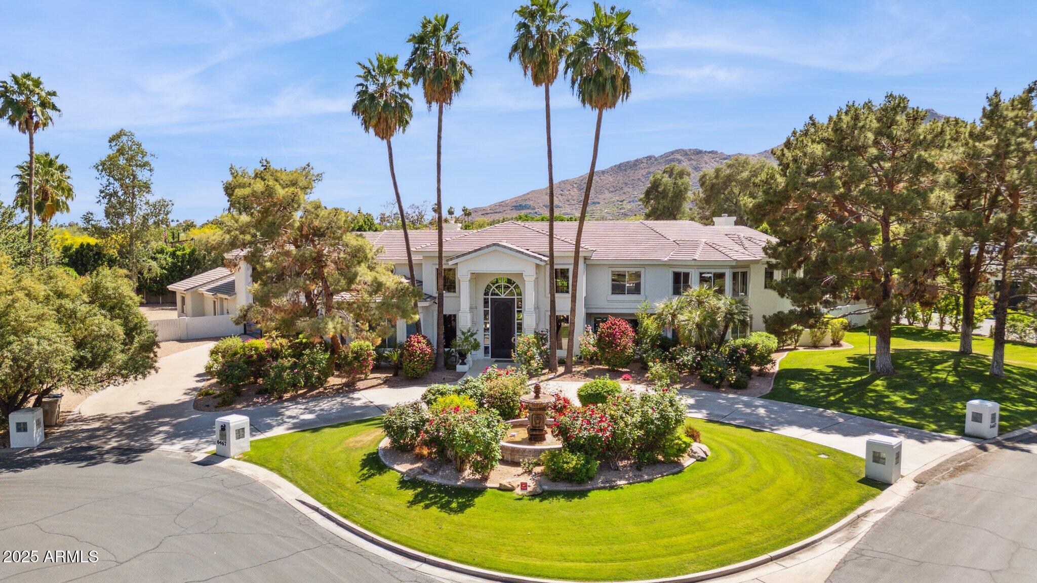 In the shadow of the Camel, highly desirable La Place 1 is a green oasis of 26 distinguished estate homes set amidst lush, mature landscaping. The gracious entrance encompasses a gated motor court and circular drive centered by a bubbling fountain & rose garden. The 15 ft. front door leads to a grand scale entryway featuring a 22 ft. ceiling and twin flying staircases, flanked by a floor-to-ceiling fireplace and wall of glass to incorporate the property's lush gardens. The floor plan includes a study, nursery, home theater, conservatory/music room, workout room and flex room. Owners are in the process of installing a glass elevator between the two main levels.