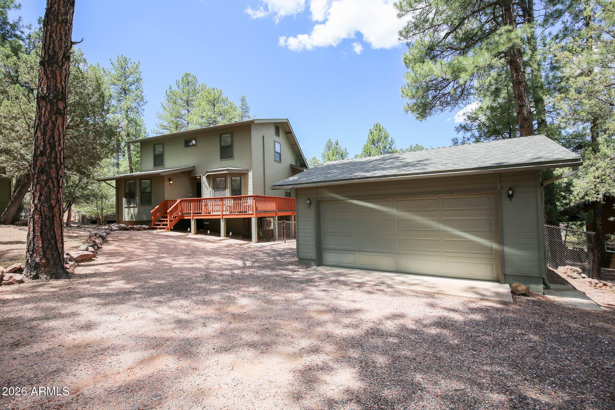 Turn-Key Mountain Retreat Among the Pines! Nestled on a beautifully treed .37-acre lot, this charming 3-bedroom, 2-bath home offers the perfect blend of comfort and mountain living. The inviting living room features luxury vinyl flooring and a cozy wood-burning fireplace, creating a warm gathering space year-round. The well-equipped kitchen includes newer appliances, making meal prep and entertaining a breeze.

Enjoy the outdoors from the spacious covered wrap-around deck, where you can relax and take in the peaceful surroundings, abundant wildlife, and fresh mountain air. The main level includes a bedroom and full bath, while two additional bedrooms and another bath are located upstairs. Thoughtfully maintained, the home features a newer roof (2021), energy-efficient mini-split systems throughout (2022), and a furnace for added comfort. Complete with a 2-car garage and sold fully furnished, this move-in-ready property is ideal as a full-time residence, vacation getaway, or investment opportunity.