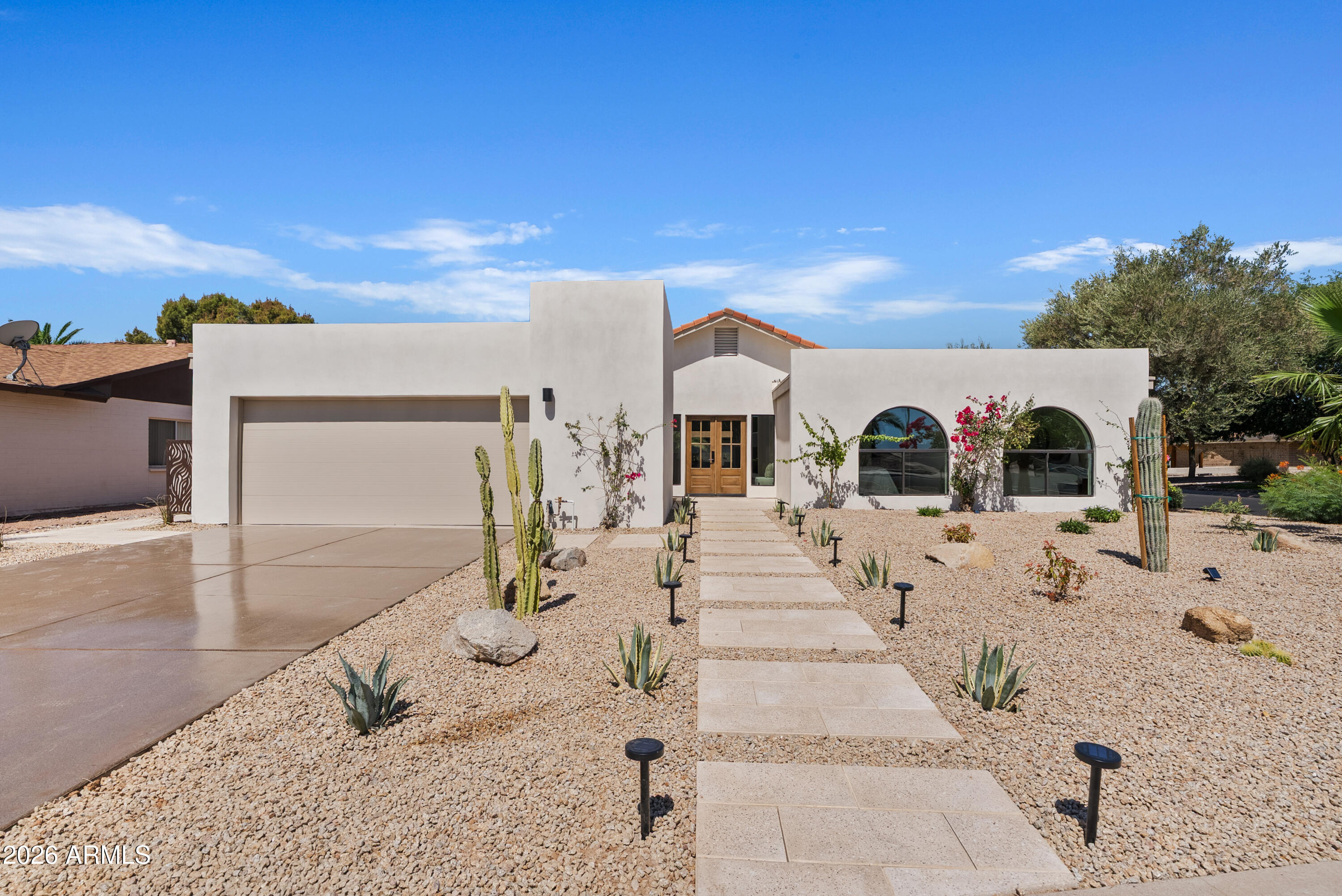 A true gem in the coveted Sands Scottsdale community of McCormick Ranch, this home was originally built by renowned developer E.T. Wright and gracefully reimagined by The Quiet Luxury Collective. Honoring its timeless architecture while embracing modern living, this home feels both refined and welcoming. Soft neutral hues, rich textures, and thoughtfully curated details create an inviting atmosphere that feels effortlessly like home. Nearly every surface, finish, and major system has been updated. Highlights include custom walnut slim-shaker cabinetry, a custom plastered range hood, smooth-finish walls, plank oak flooring, designer tile, statement lighting, and eco-friendly fixtures. Significant capital improvements include a new roof, HVAC system, hot water heater, dual-pane energy-efficient windows, smart washer and dryer, insulated garage door, fresh exterior paint, and new sand-finish stucco, all complemented by comprehensive warranties for long-term peace of mind. The transformation extends outdoors with professionally designed front and rear landscaping, a finished marble-pumice garage floor, and a freshly sealed driveway. Perfectly positioned just moments from the Greenbelt, scenic lakes, championship golf courses, upscale dining, premier shopping, entertainment, and convenient access to Loop 101, this home is also located within Scottsdale's highly acclaimed 3 C's school district. E.T. Wright homes are celebrated and opportunities to own one in McCormick Ranch are few and far between. Experience the character and refined simplicity that make this home truly special.