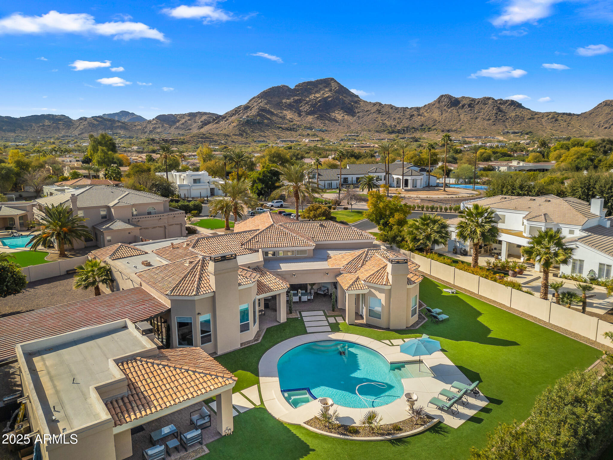 Welcome to the exclusive gated community of Cantatierra! This fully renovated estate is a breath of fresh air. No expense spared for this modern transitional 4 bedroom estate. Walking in the front door you'll be delighted with the tall ceilings, designer finishes and tile and Oak flooring.  Beautiful dining room with adjacent wine/beverage bar. Stunning open kitchen with island and an eat-in peninsula, six top gas range, double oven, two sink and custom cabinetry. Relax in the primary suite with spacious sleeping area, sitting room with gas fireplace, oversized primary bathroom with dual sinks, makeup vanity, soaking tub, huge walk-in shower and impressive clothing closet. The family room is perfect for large gatherings with a full wet bar and telescoping doors. Two expansive covered patios for outdoor dining or lounging near the fireplace. Sparkling pool and pristine artificial turf make the backyard lovely to enjoy and easy to maintain. The detached guest house could make for a 5th bedroom or a fantastic hosting/pool house environment.