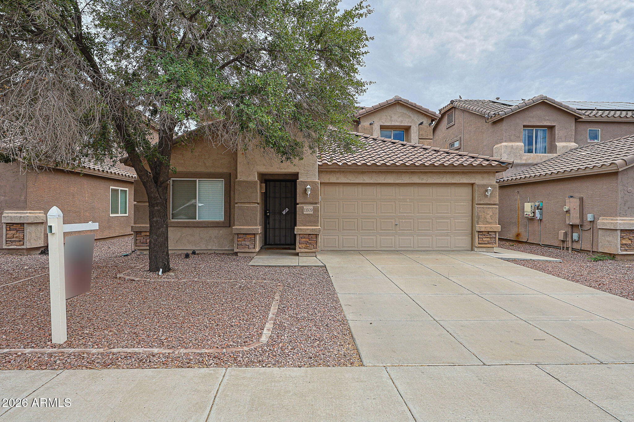 Welcome Home to this great 4 bedroom, 2.5 bath home in a quiet neighborhood. Plenty of space for your family. Walk in to the formal living/dining room that leads to the open concept kitchen/family room. Primary suite is downstairs with private bathroom and large walk in closet. Laundry and 1/2 bath are down stairs also. 3 secondary bedrooms upstairs with a large loft for extra area for the kids to just hang out.  Front yard is gravel, Backyard  has a covered patio, some turf and gravel. Close to the 101, Stadium, West Gate and Shopping.