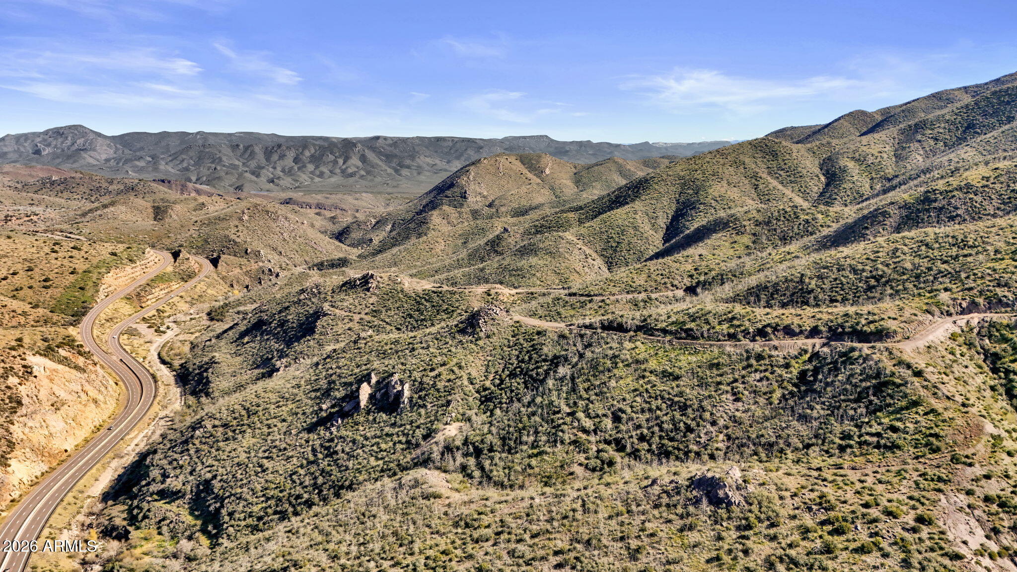 Exceptional opportunity to acquire approximately 320 +/- contiguous acres with commanding Highway 87 frontage in the highly desirable Slate Creek / Mount Ord corridor, just south of Payson in Arizona's Rim Country. Rarely does a property of this scale, visibility, and zoning diversity come to market in this region. The site encompasses multiple zoning designations (C2, C1, and GR), providing outstanding flexibility for a wide range of commercial, mixed-use, recreational, and long-term investment concepts. Recreational property, Cabin sites, Nature Preserve, Hiking/Camping, Ranching, Mining, Forest Exchange, etc. C2 zoning supports highway-oriented commercial uses such as retail, office, medical, hospitality, and food and beverage, while C1 zoning allows neighborhood-scale retail and pro fessional services. GR zoning further enhances flexibility with allowances for low-density residential, agricultural, recreational, and specialty rural uses, creating a uniquely versatile entitlement profile across the property.
The land offers dramatic Rim Country scenery, featuring varied topography, natural drainage corridors, existing access paths, and sweeping mountain and canyon views. Combined with substantial frontage and visibility along Highway 87, the property is well-positioned for phased development, creative site planning, or strategic land banking in a growing regional corridor.
Located in unincorporated Gila County. Buyer to verify zoning, permitted uses, access, utilities, water availability, and development potential.