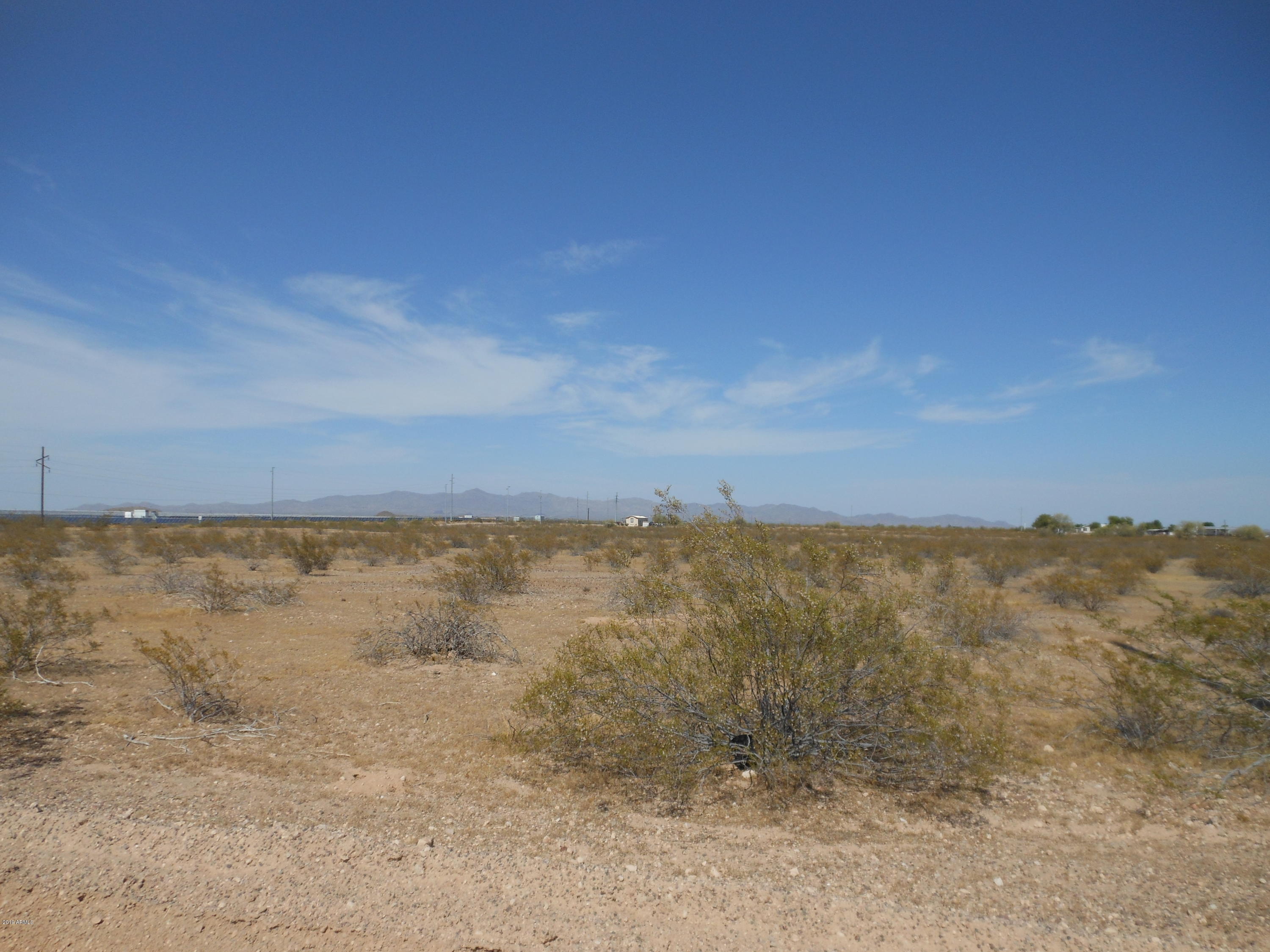 A level hard corner 34 acre parcel located south of the Belmont Master Planned Community. A potentially good commercial site. Owner will consider a carryback.