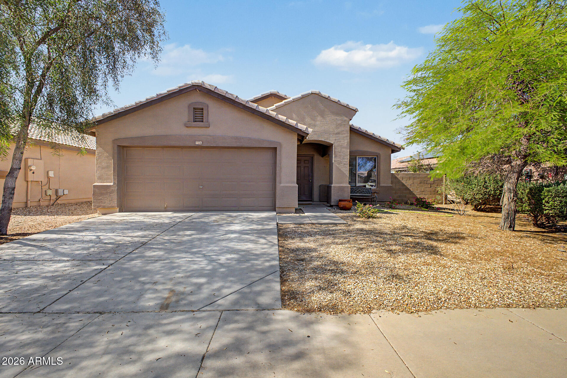 Beautiful 3-bedroom, 2-bath home with a 2-car garage and tile flooring throughout. This open-concept layout features white kitchen cabinetry and spacious living areas, perfect for everyday living and entertaining. Ceiling fans are installed in all major areas for added comfort. The primary suite includes a walk-in closet. Enjoy the convenience of an indoor laundry room and a generously sized backyard with a covered patio--ready to be transformed into your own outdoor retreat. Ideally located with easy access to Loop 303.