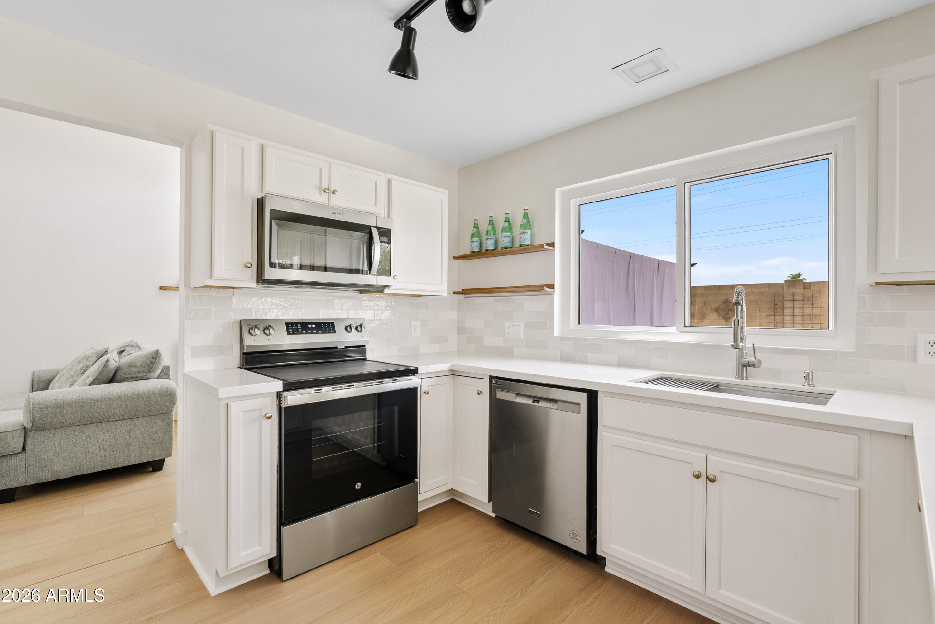 Welcome to your dream home -- thoughtfully updated and truly move-in ready, with over $70,000 in improvements already completed for the next lucky owner! This stunning 3-bedroom, 2.5-bath residence pairs a bright, airy open floorplan with tall ceilings and the peace of mind that comes from having all the big investments already done. A brand-new Trane HVAC system with a smart, app-controlled thermostat (2024, transferable warranty), all-new windows and sliding glass door, and a full roof replacement with a transferable 10-year warranty mean the major systems are handled. Behind the scenes you'll also find updated plumbing, added attic insulation, and more.
Inside, the home is as beautiful as it is worry-free. The heart of the home--the kitchen-- shines with new cabinetry, quartz countertops, a stylish backsplash, and a full suite of new appliances. All of the bathrooms have been updated completely. You'll find new vanities and cabinetry, quartz counters, new showers/tubs, new toilets, and new fixtures. New luxury vinyl flooring flows throughout the entire home (no carpet anywhere!), complemented by fresh interior AND exterior paint, updated lighting fixtures inside and out, new door hardware, and a formal dining room anchored by a beautiful stone fireplace. The great room and cozy family room keep the home feeling open and functional.
Step outside to a large, private backyard with a new paver patio, fresh landscaping, and no neighbors behind you--ideal for relaxing and entertaining. Meticulously cared for and completely turnkey, this exceptional home is ready to welcome its next family. Don't miss it!