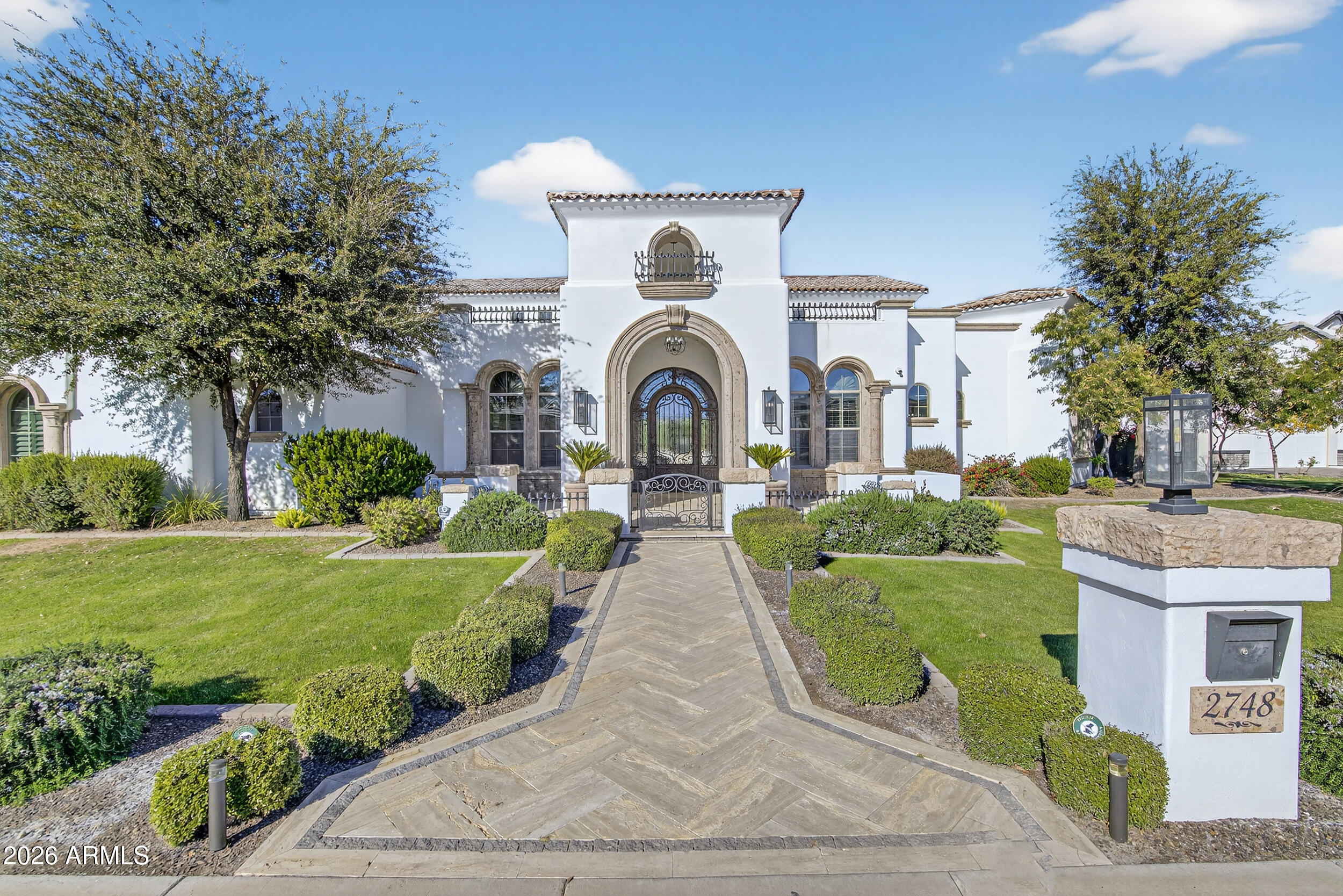 Opportunities like this simply do not come around often in Whitewing at Germann Estates, especially among the community's limited collection of custom built homes. Set on a half acre lot, this 6,419 square foot residence offers 6 bedrooms, 6 bathrooms, a full basement, and a 3 car garage, blending scale, sophistication, and thoughtful design in one of the East Valley's most coveted guard gated communities. From the moment you arrive, the pride of ownership is unmistakable, with professionally maintained landscaping, fresh interior and exterior paint, and a fully refreshed presentation that makes this home feel truly turnkey.

Inside, the home has been extensively refreshed with modern finishes throughout, highlighted by a redesigned kitchen and a spa inspired primary suite featuring a standalone jacuzzi tub. The fully finished basement is an entertainer's dream, complete with a state of the art movie theater and upgraded equipment for an elevated viewing experience. The residence is fully integrated with Control4 technology controlling cameras, lighting, speakers, and security. Outdoors, the resort style backyard features a saltwater pool, misters, outdoor speakers, and an outdoor shower, creating a private oasis for year round enjoyment. Car enthusiasts will appreciate the coated garage floors, hexagon lighting, EV charger, 12,000 lb car lift, extended parking pad behind the RV gate, and a walking path to the backyard, making this a rare opportunity to own a meticulously curated lifestyle home in Whitewing at Germann Estates.