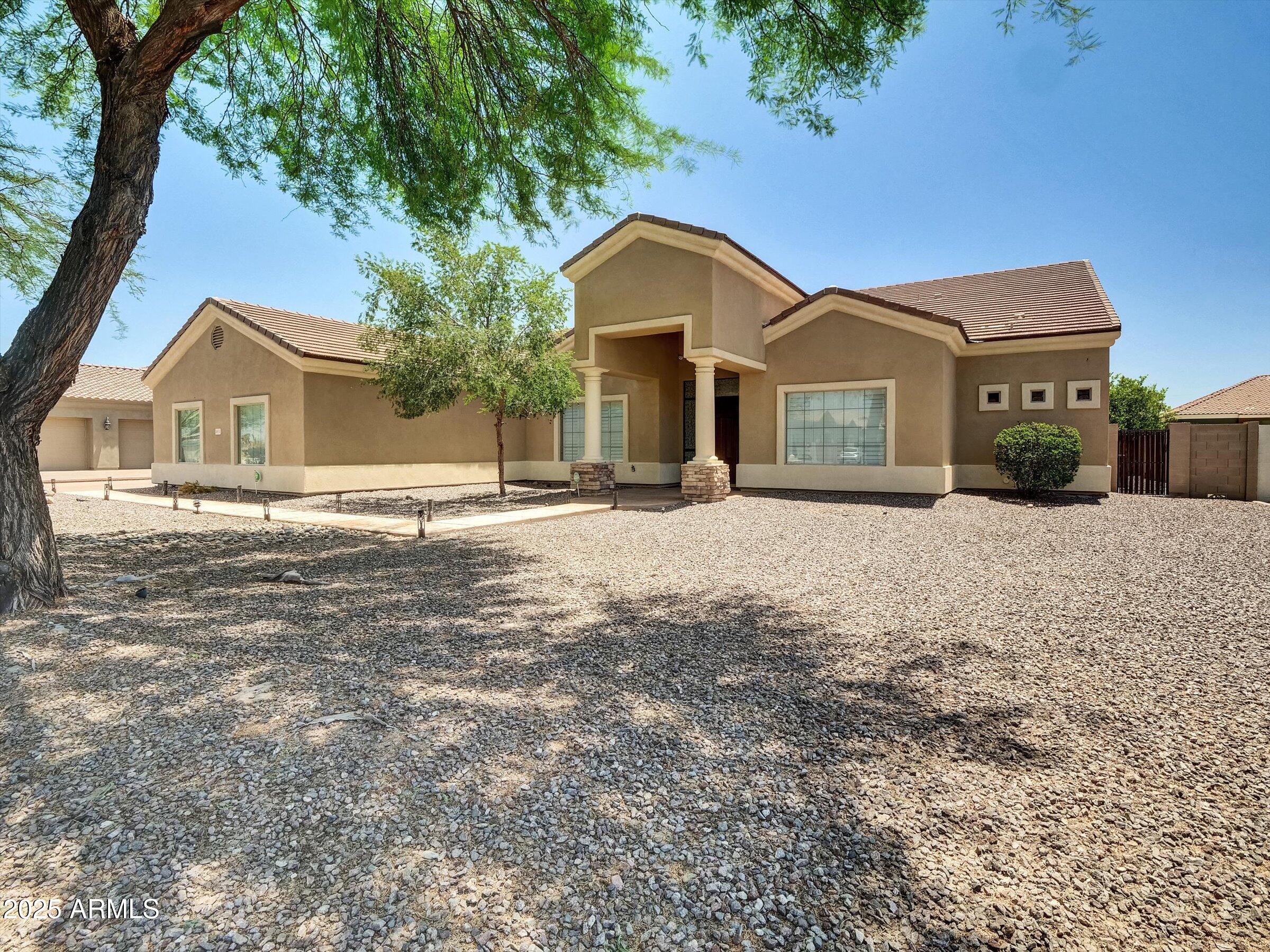 LOOKING FOR A HUGE SINGLE LEVEL CUSTOM HOME IN A GATED COMMUNITY?  THIS IS IT!  HUGE 4BEDS, 4.5BATHS, 4CAR-GARAGE, ON ALMOST HALF ACRE LOT, WITH PRIVATE POOL. NICE GORMADE KITCHEN SET UP WITH GRANITE COUNTERTOPS, STAINLESS STEEL APPLIANCES, THE KITCHEN OVERLOOK FAMILY ROOM WITH SOARING 12' CEILING THROUGH OUT.  EACH BEDROOM HAS IT OWN BATHROOM.  THE PROPERTY IS LOCATED ONLY A FEW MINUTES TO WESTGATE ENTERTAINMENT DISTRICT WITH MANY RESTAURANTS, SHOOPING, AND EASY ACCESS TO LOOP-101.  GREAT OPPOTUNITY TO OWN A HUGE CUSTOM HOME IN A NEW BOOMING AREA OF GLENDALE.   IT'S  A MUST SEE!