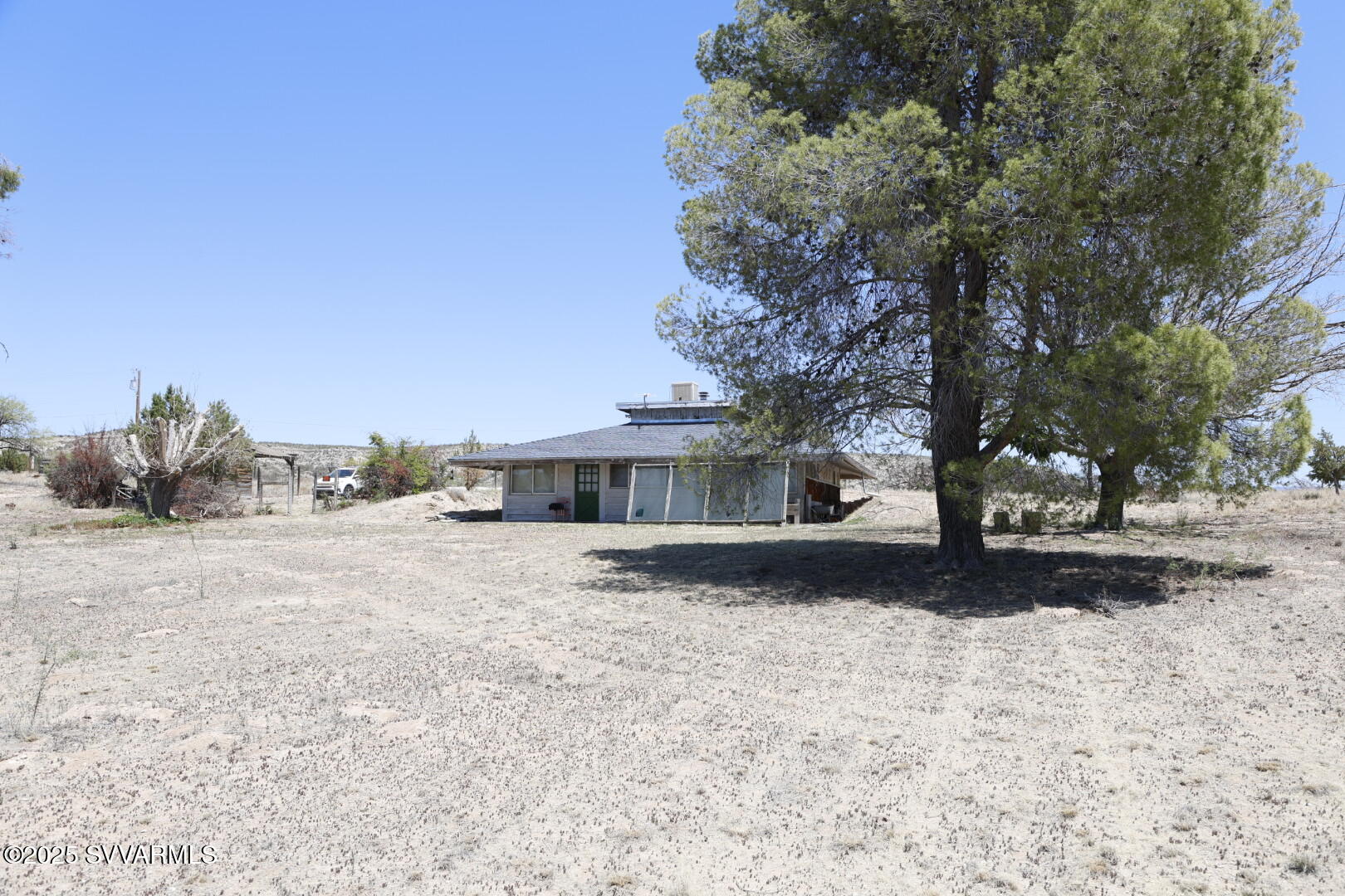 Offered with the adjacent parcel 403-18-095 for a combined total of 4.56 acres, this Camp Verde opportunity provides space and flexibility for a peaceful rural homestead. The custom two-bedroom home sits on 2.31 acres with views of Mingus Mountain and the Black Hills, featuring rustic charm, solid construction, built-in storage, a cozy breakfast nook, welcoming front porch where you can watch summer storms gather over the mountains, enjoy vibrant sunsets, and take in brilliant star-filled night skies.    Private well, septic, and electricity are already in place. The additional 2.25-acre parcel may remain separate or combine with the main parcel, offering possibilities for a second home, barn, or expanded homestead.