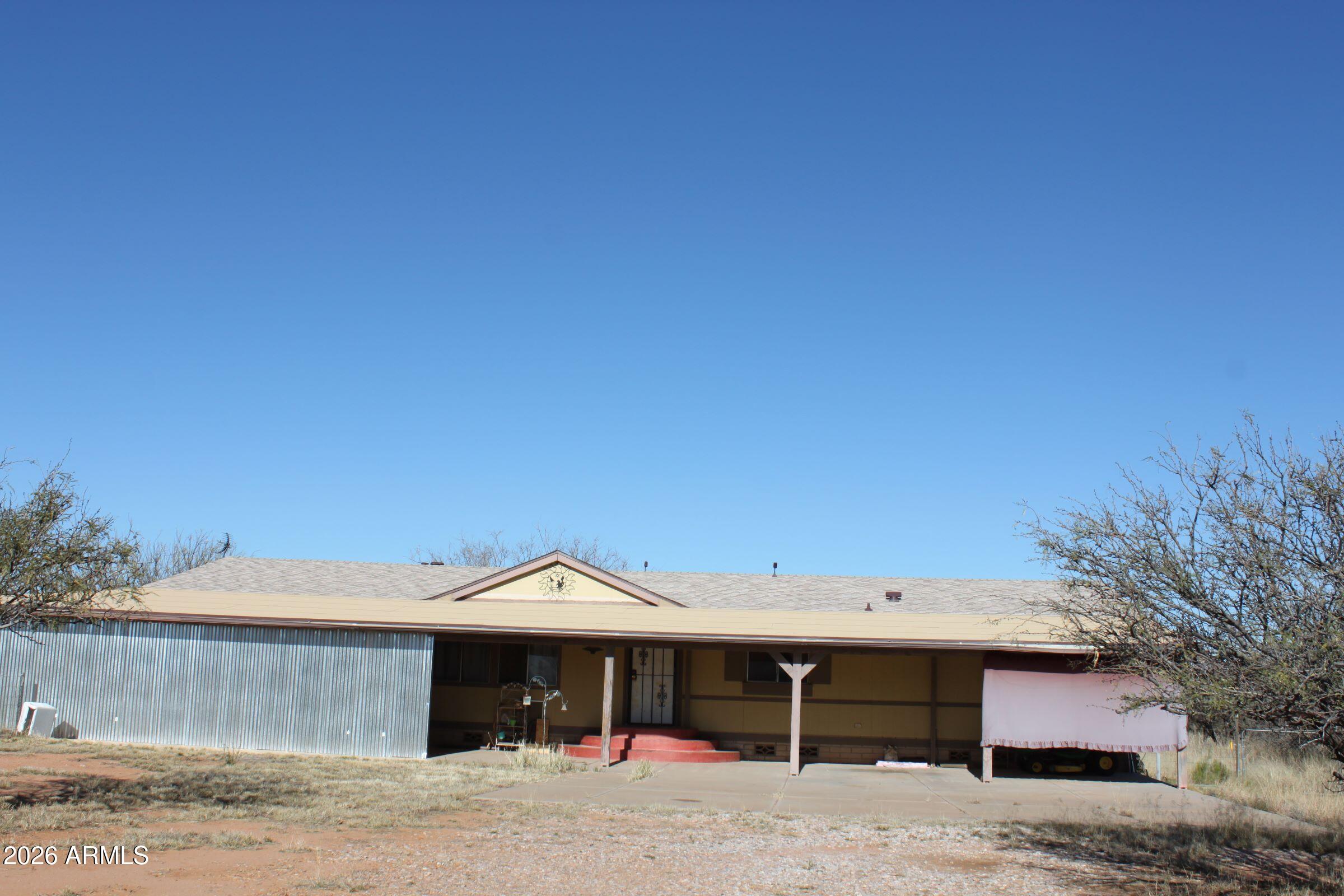 Here is an opportunity to own a desirable home in a great location.  4BR/2BA..Family room, formal living room, spacious dining area.  Utility/laundry leads to a fenced backyard.  Full length covered patio on west side of home.  Fenced and cross fenced.  Mature trees...ideal for horses, 4-H projects.
Views of Huachuca Mtns.  Mule Mtns. and San Jose.
New roof in recent years.