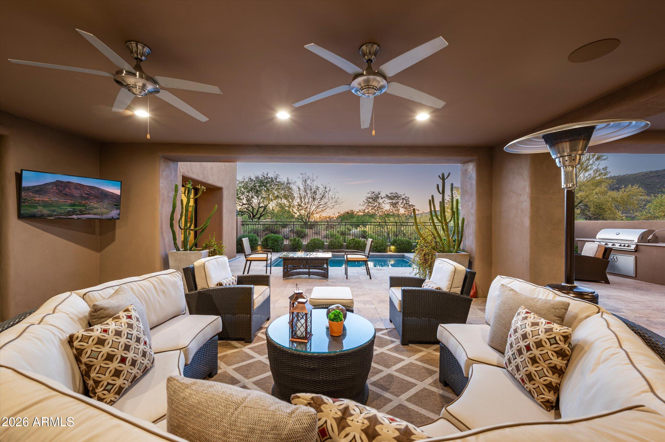 A Desert Mountain Golf Membership is available with this ''Total Turnkey'' offering. Situated in the private, guard-gated community of Desert Mountain in North Scottsdale, this home provides access to world-class amenities. The warm contemporary custom design features a convenient no-step floor plan, with the great room flowing into the kitchen and dining areas. Outdoor entertaining is ideal with a spacious covered patio, BBQ area, jetted spool, and ample privacy. The gracious primary bedroom includes a luxurious bath with heated floors in both the bathroom and closet, dual water closets, and dual vanities. An office is located within the primary wing, while the guest wing features two en-suite bedrooms. All Desert Mountain Amenities immediately with 6 Golf Courses, 9 Tennis, 8 Pickel & mo