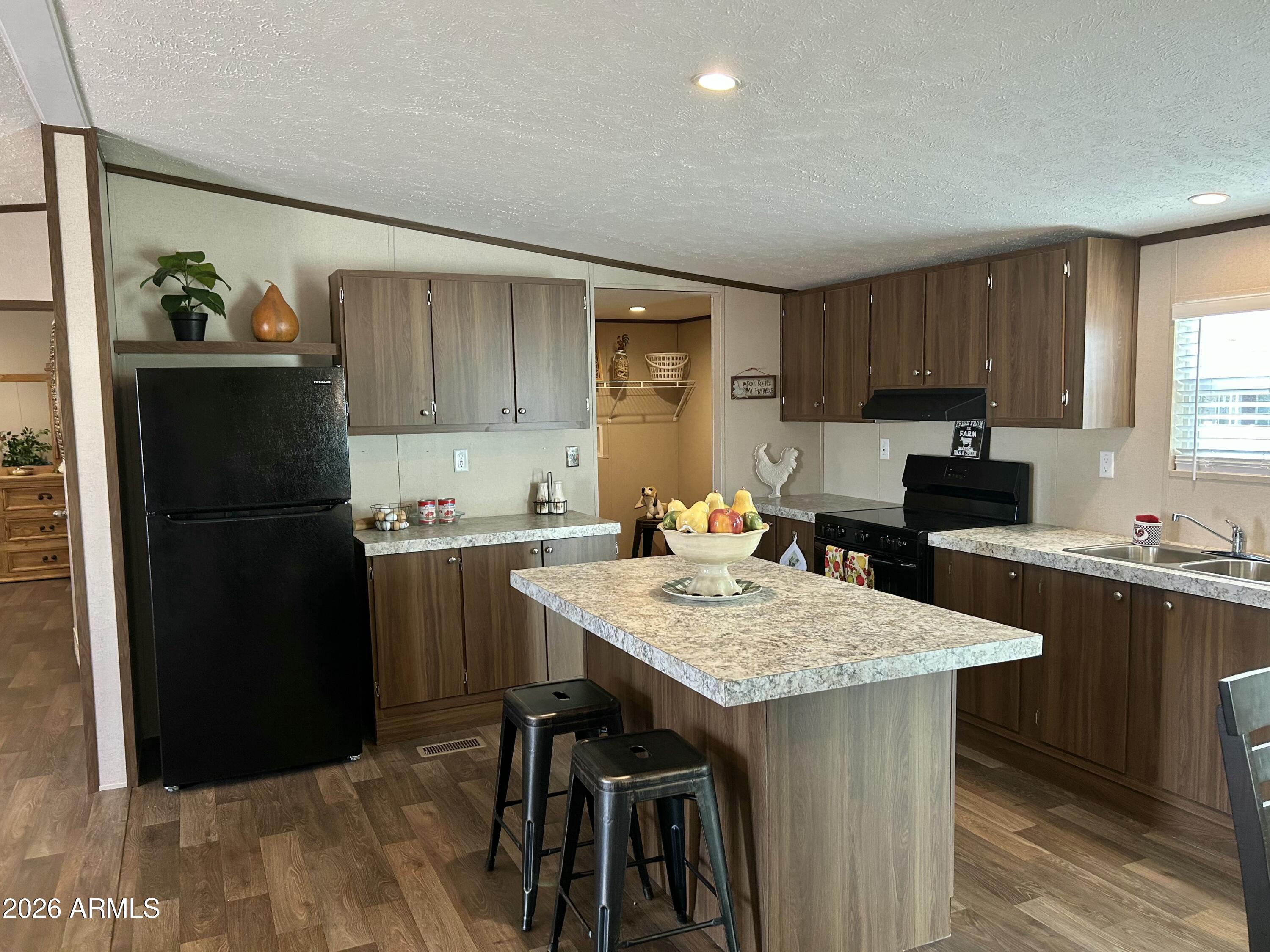Don't miss this amazing opportunity to be the first to own this stunning home located in one of Eloy's fastest-growing areas! This spacious 4-bedroom, 2-bath gem features a split floor plan for added privacy, including a massive primary suite with a luxurious bathroom and a generous walk-in closet. The heart of the home offers an open-concept kitchen and dining space, complete with a refrigerator, stove, and dishwasher already included just bring your personal touch! Enjoy the convenience of an indoor laundry room and the comfort of modern finishes throughout. Whether you're a first-time buyer or looking for a fresh start, this home checks all the boxes.