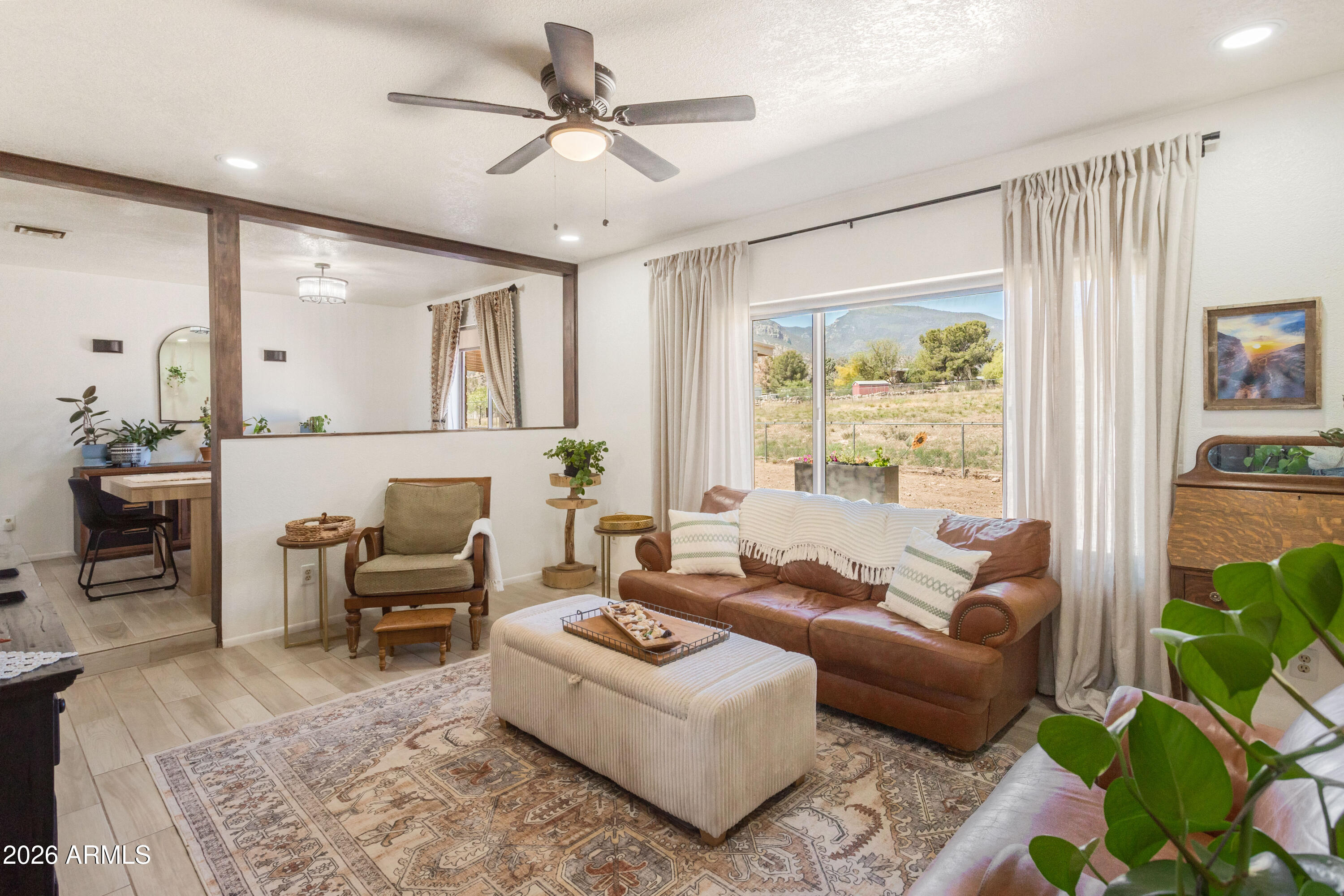 Sitting on a spacious 1.229-acre lot in the highly sought-after neighborhood of Pueblo Del Sol, this exceptional property offers stunning views of the Huachuca Mountains, versatile living spaces, beautifully updated interiors, and no HOA.

The main residence features 3 bedrooms, 2.5 bathrooms, and an extended 2-car garage with a separate storage/workshop area. Thoughtful updates include new kitchen appliances (2024), remodeled kitchen and bathrooms (2025), and wood-grain tile and LVP flooring throughout.

Enter through the meticulously landscaped central courtyard, creating a warm and inviting first impression. Inside, you'll find a bright and open living room with a spacious dining area, along with a separate family room just off the kitchen, complete with a cozy wood-burning fireplac and charming tongue-and-groove ceiling. The kitchen serves as the heart of the home, featuring granite countertops, Samsung appliances, ample cabinet and counter space, an oversized pantry, and a dedicated coffee/bar station, perfect for both everyday living and entertaining. The fully fenced backyard is expansive and private, offering two covered patios and breathtaking mountain views, creating the ideal setting to relax or host guests.

Adding incredible flexibility, the property also includes a separate guest house with 1 bedroom, 1 bathroom, a living area, kitchenette with full-size refrigerator, and its own 1-car garage. Equipped with its own HVAC system and water heater, this space is perfect for guests, extended family, or potential rental income.


With its combination of modern updates, multi-generational living potential, and serene desert surroundings, this is a rare opportunity and a must-see.