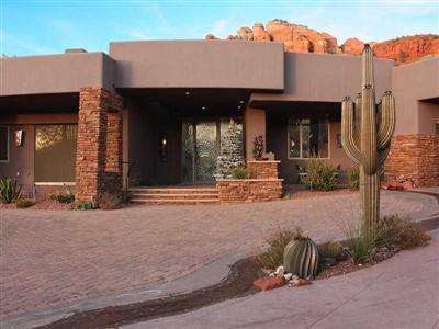 CLICK BELOW FOR THE VIRTUAL TOUR! Nestled at the base of Cathedral Rock, this unique home is a private retreat set above the road and bordering forest service. With spectacular views from nearly every room and beautiful details provided by many local artists, this home has a warm contemporary feel. Third garage accommodates small RV and shop w/heat/cool, astronomy deck above. Exterior sun shades and Interior motorized blinds where needed for privacy and heat control. Arizona room has motorized screens. Fireplaces in main house are wood burning but have Fire 'n Ice. Owner/Agent